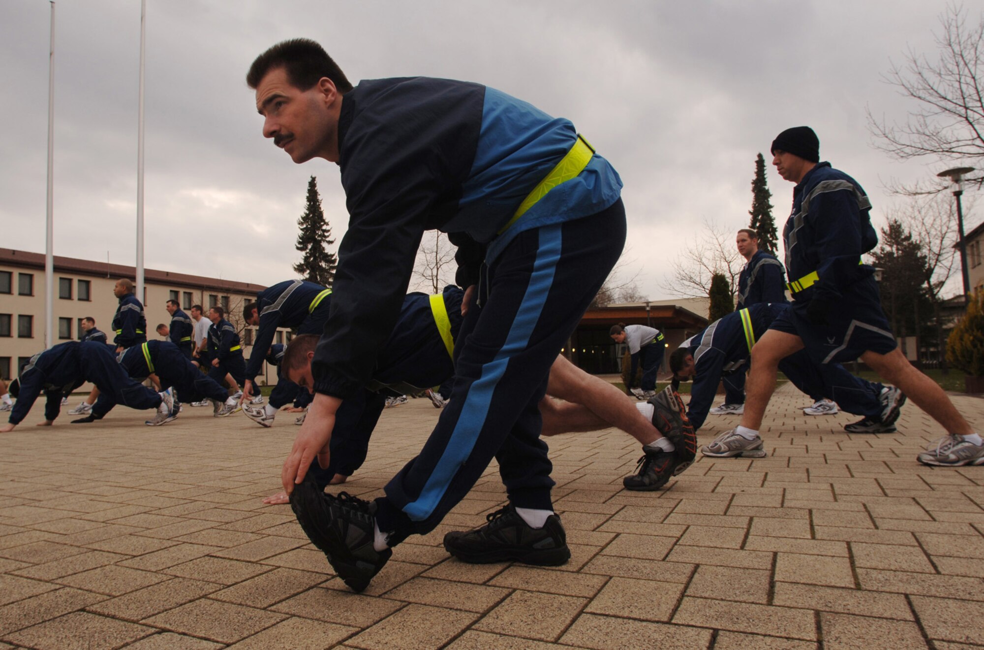 German Air Force Master Sgt. Holger Fels joins fellow Kisling Noncommissioned Officer Academy students in a daily physical training session at Kapaun Air Station, Germany. Sergeant Fels, a German NCO Academy instructor in Appen, Germany, voluntarily enrolled in the six-week academy course designed for U.S. Air Force technical sergeants to prepare for a four-year special duty assignment as an exchange instructor at the Senior NCO Academy at Maxwell Air Force Base, Alabama. Photo by Master Sgt. Scott Wagers / (released)