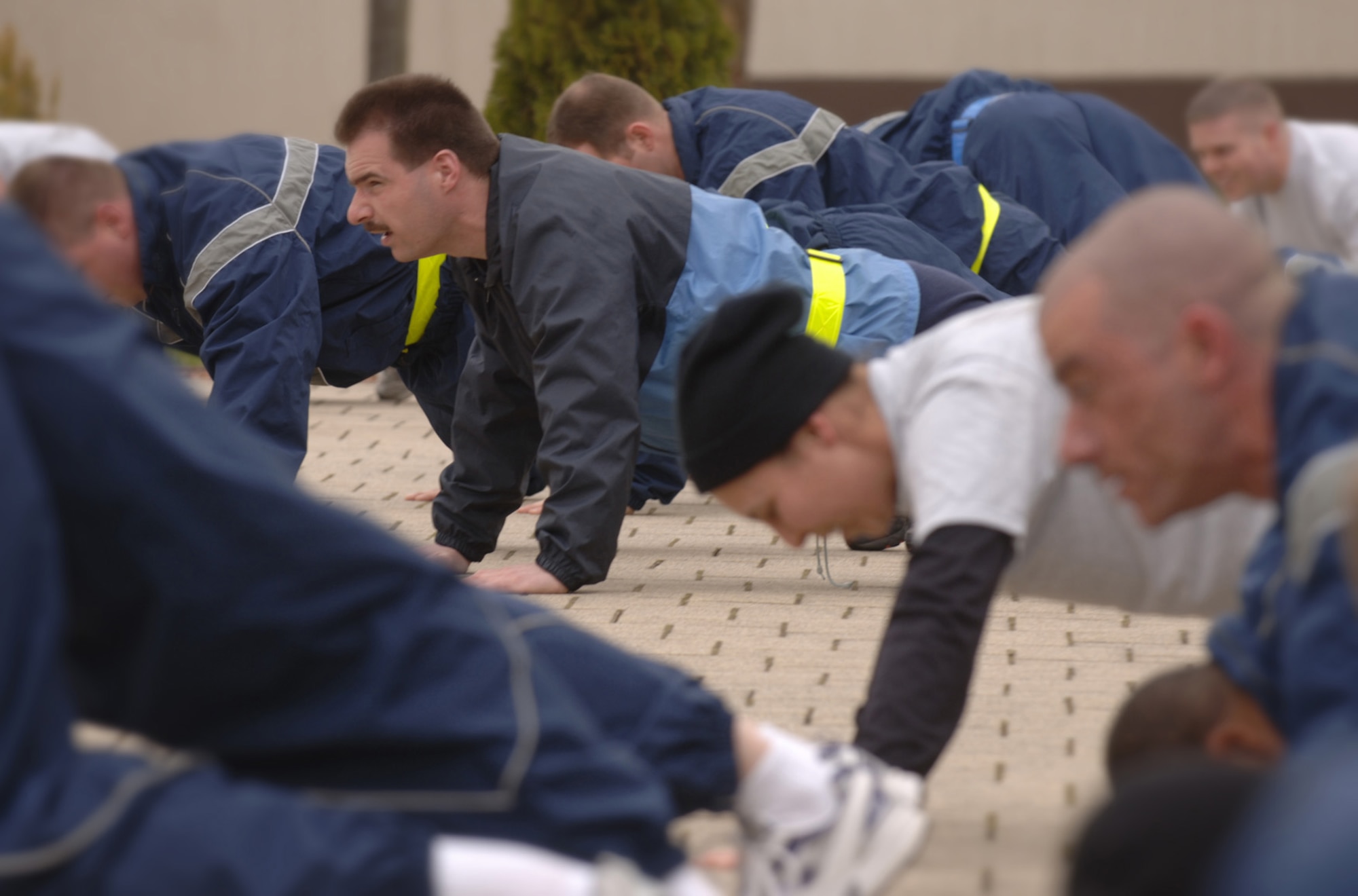 German Air Force Master Sgt. Holger Fels joins fellow Kisling Noncommissioned Officer Academy students in a daily physical training session at Kapaun Air Station, Germany. Sergeant Fels, a German NCO Academy instructor in Appen, Germany, voluntarily enrolled in the six-week academy course designed for U.S. Air Force technical sergeants to prepare for a four-year special duty assignment as an exchange instructor at the Senior NCO Academy at Maxwell Air Force Base, Alabama. Photo by Master Sgt. Scott Wagers