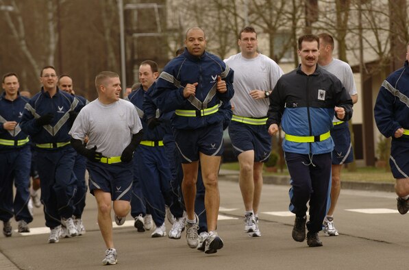 German Air Force Master Sgt. Holger Fels joins fellow Kisling Noncommissioned Officer Academy students in a daily physical training session at Kapaun Air Station, Germany. Sergeant Fels, a German NCO Academy instructor in Appen, Germany, voluntarily enrolled in the six-week academy course designed for U.S. Air Force Technical Sergeants in preparation for a four-year special duty assignment as an exchange instructor at the Senior NCO Academy at Maxwell Air Force Base, Alabama. Photo by Master Sgt. Scott Wagers
