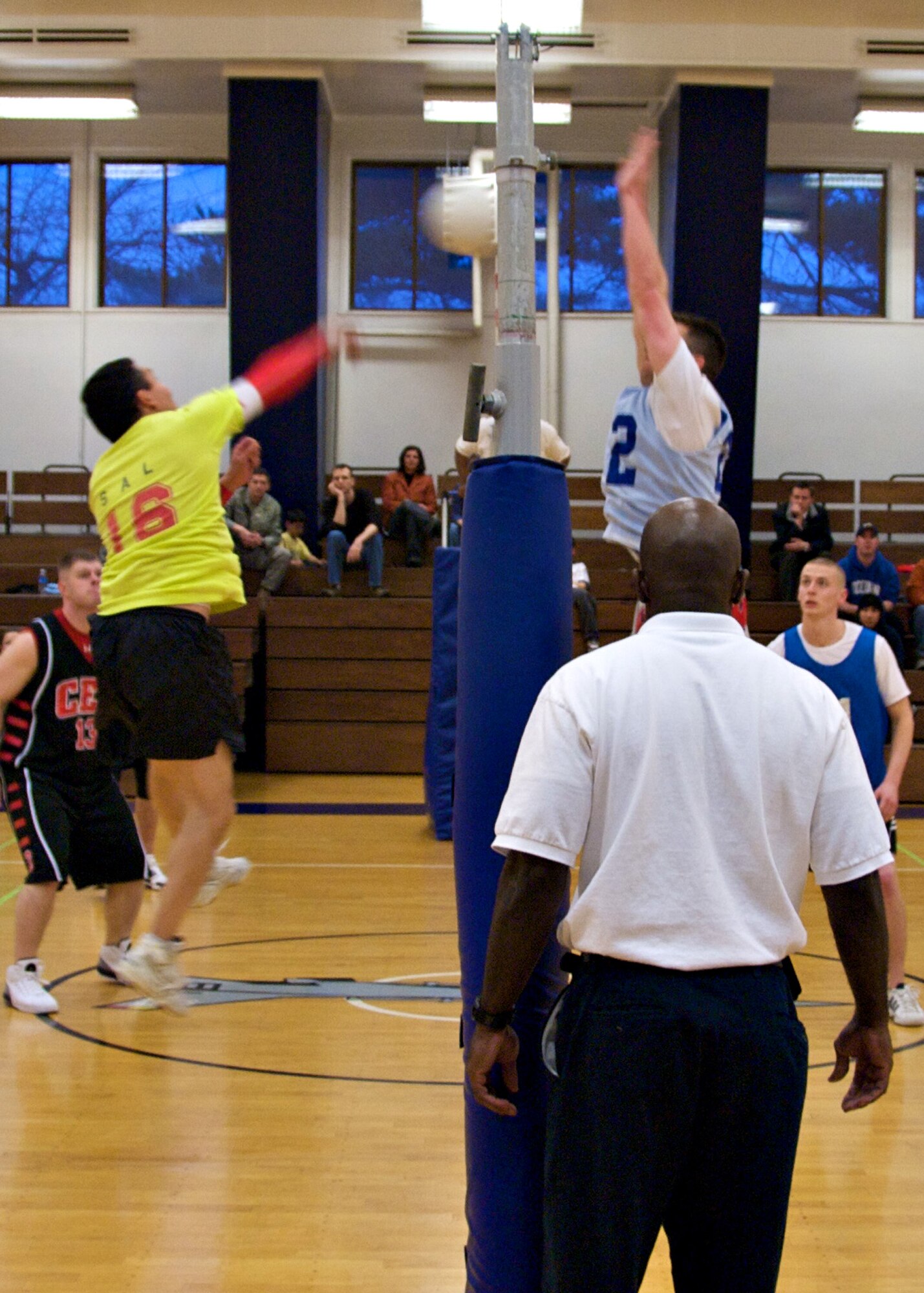 MISAWA AIR BASE, Japan -- A team member from the 35th Civil Engineer Squadron(left) spikes the ball over the net, while a team member from the 373rd Intelligence Group prepares to block it during a championship match at the Potter Fitness Center April 14, 2008. The 35th CES defeated the 373rd IG in two games and took home the title of champions. (U.S. Air Force photo by Senior Airman Chad Strohmeyer)