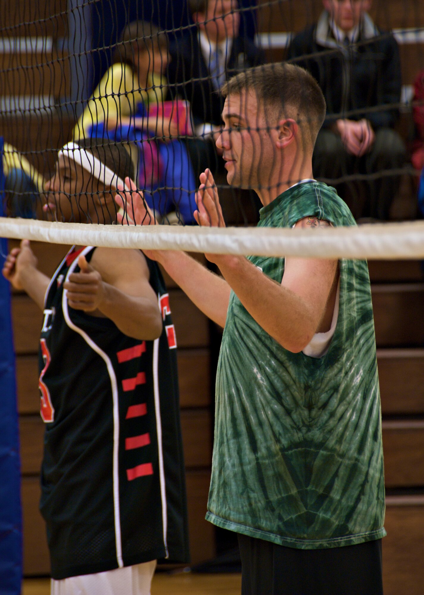 MISAWA AIR BASE, Japan -- Players on the 35th Civil Engineer Squadron volleyball team guard the net as the opposing team prepares to serve the ball during the intramural volleyball championship at the Potter Fitness Center on April 14, 2008. The 35th CES won the championship beating the 373rd Intelligence Group in two games. (U.S. Air Force photo by Senior Airman Chad Strohmeyer)