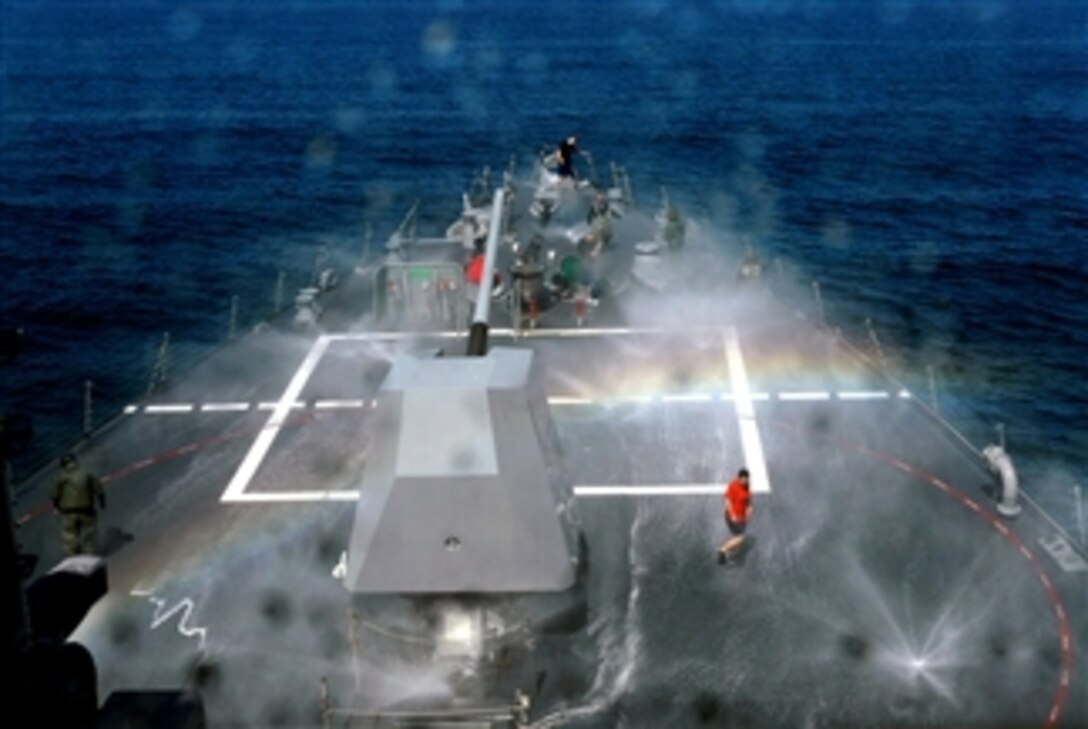 The crew of the USS Howard inspect the saltwater sprinkler system during a counter measure wash down test, April 11, 2008, in preparation for a deployment. 