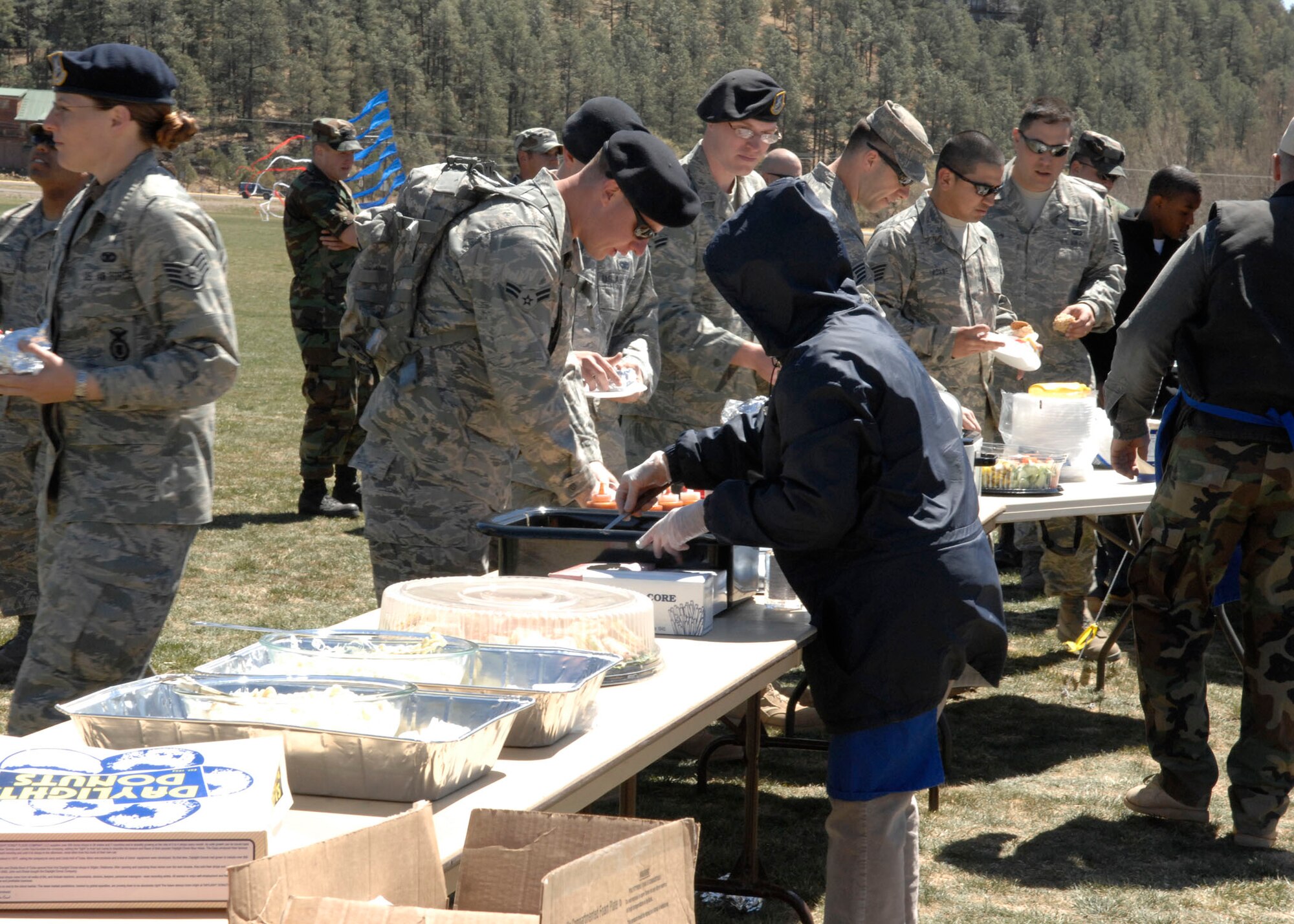 RUIDOSO, N.M. --Military member's from Holloman Air Force Base, N.M., receive free food during the Military Appreciation Weekend here.  Apr. 11. The Airmen were part of the initial set up crew for the MAW. (U.S. Air Force photo/Airman 1st Class Rachel A. Kocin)