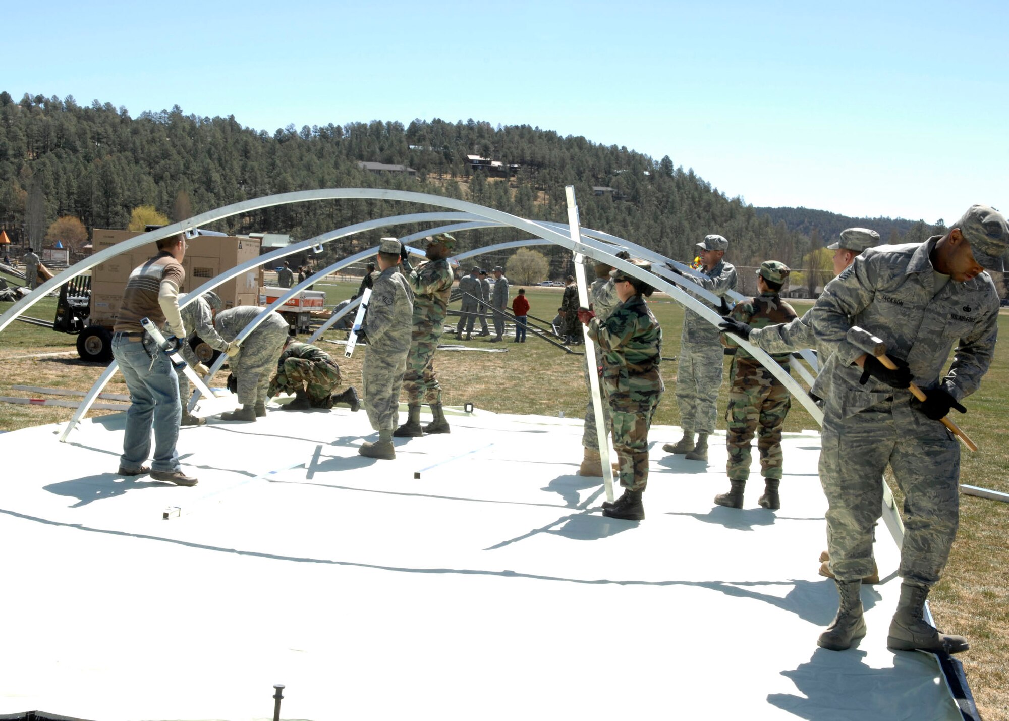 RUIDOSO, N.M. -- Military members from Holloman Air Force Base, N.M., set up tents for military demonstrations during the Military Appreciation Weekend here Apr. 11. (U.S. Air Force photo/Airman 1st Class Rachel A. Kocin)