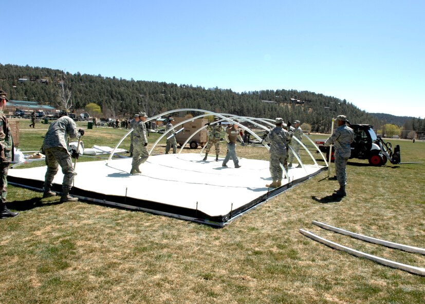 RUIDOSO, N.M. -- Military members from Holloman Air Force Base, N.M., set up tents for military demonstrations during the Military Appreciation Weekend here Apr. 11. (U.S. Air Force photo/Airman 1st Class Rachel A. Kocin)