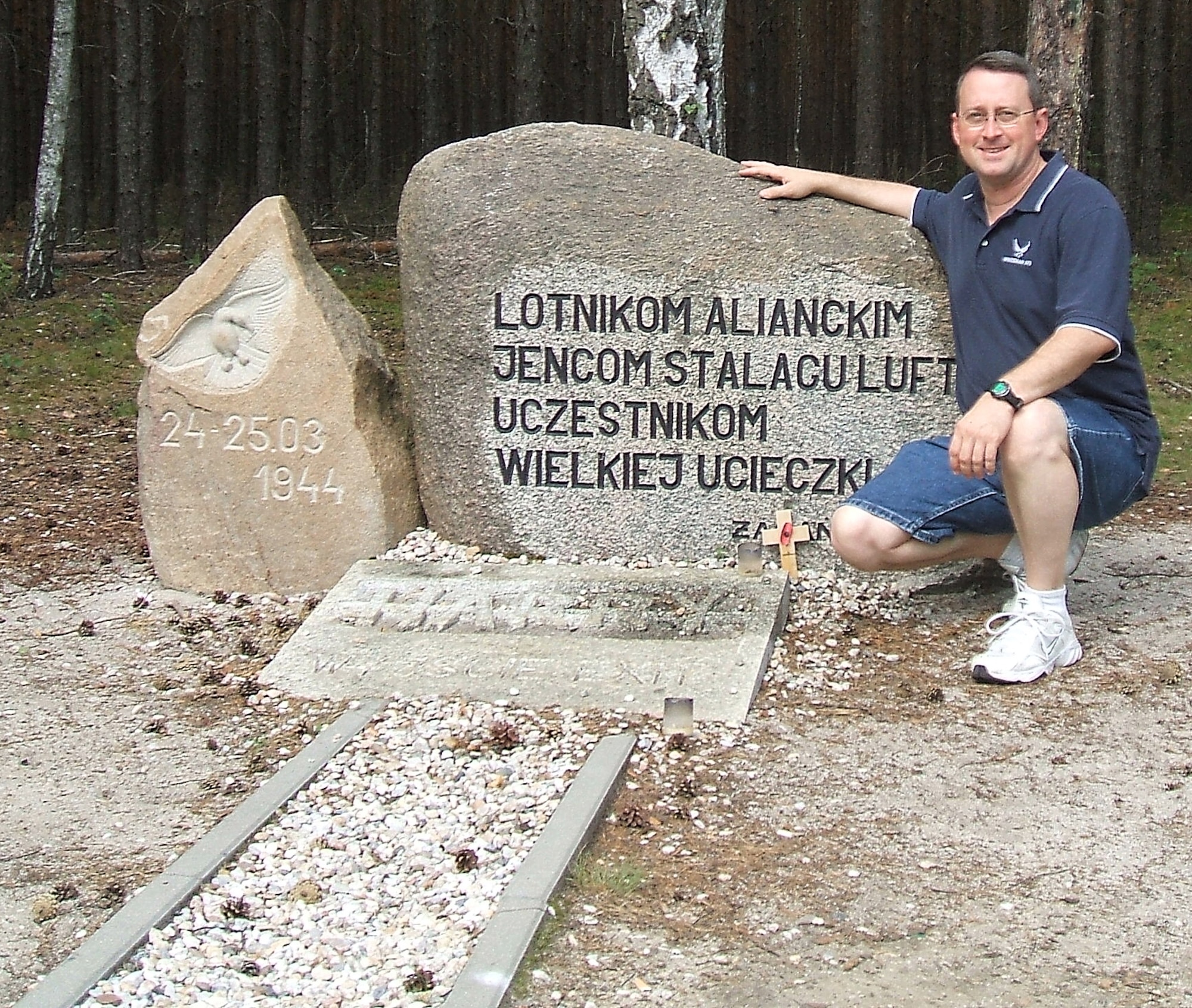Tech. Sgt. Leo Brown, an Air Force reservist with the 442nd Fighter Wing's public affairs office at Whiteman Air Force Base, Mo., recently won the Department of Defense's Thomas Jefferson Award for a four-part series he wrote about World War II prisoners of war in Germany.  While researching the series, Sergeant Brown pauses for a photo at the site of the POW-dug "Harry" escape tunnel exit at the site of Stalag Luft III near Sagan, Poland.  (Courtesy photo)