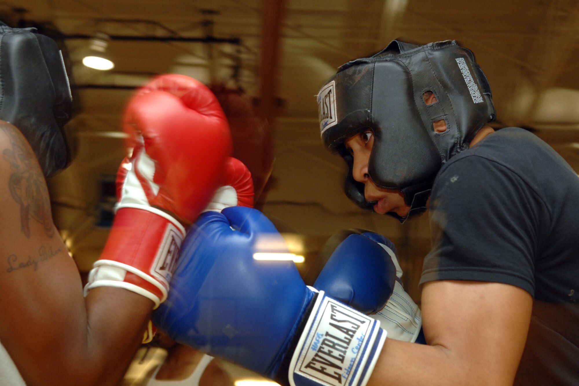 HOLLOMAN AIR FORCE BASE, N.M. -- Airman 1st Class Willie Bivins, 49th Maintenance Squadron, spars against Staff Sgt. Genese Williams, 49th Materiel Maintenance Support Squadron, during boxing practice at the Sports and Fitness Center here. Airman Bivins and Sergeant Williams are part of the boxing club which holds practice Tuesdays and Thursdays at 6 p.m. (U.S. Air Force photo/Airman 1st Class Jamal D. Sutter)