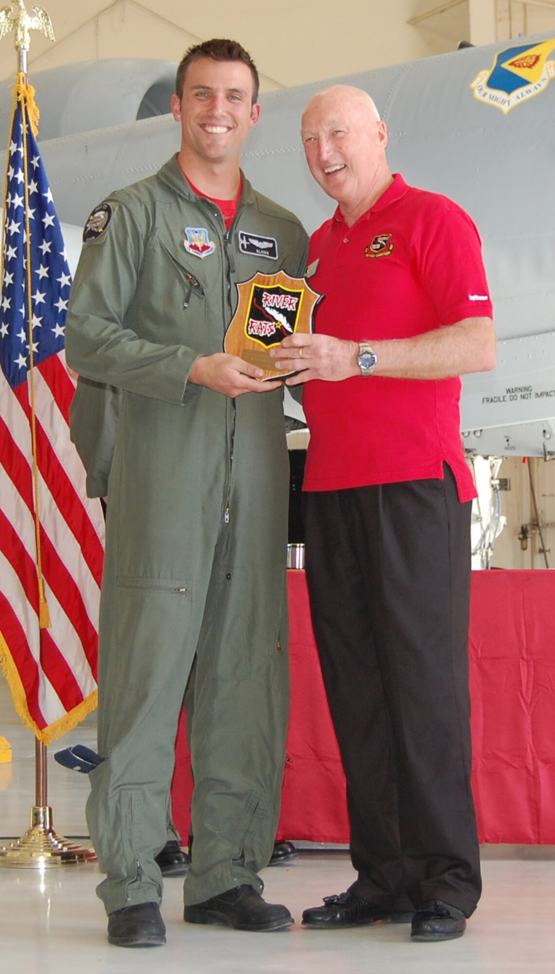 1st Lt. Ryan “Klicks” Young, poses with retired Brigadier General Keith Connolly, after receiving the Red River Valley Fighter Pilot Association Warrior Award at the 08-ABD graduation here April 11. Lieutenant Young graduated from the initial A-10 qualification course with 11 other pilots and will be assigned to the 25th Fighter Squadron at Osan Air Base in the Republic of Korea. (U.S. Air Force photo by 2nd Lt. Mary Pekas)