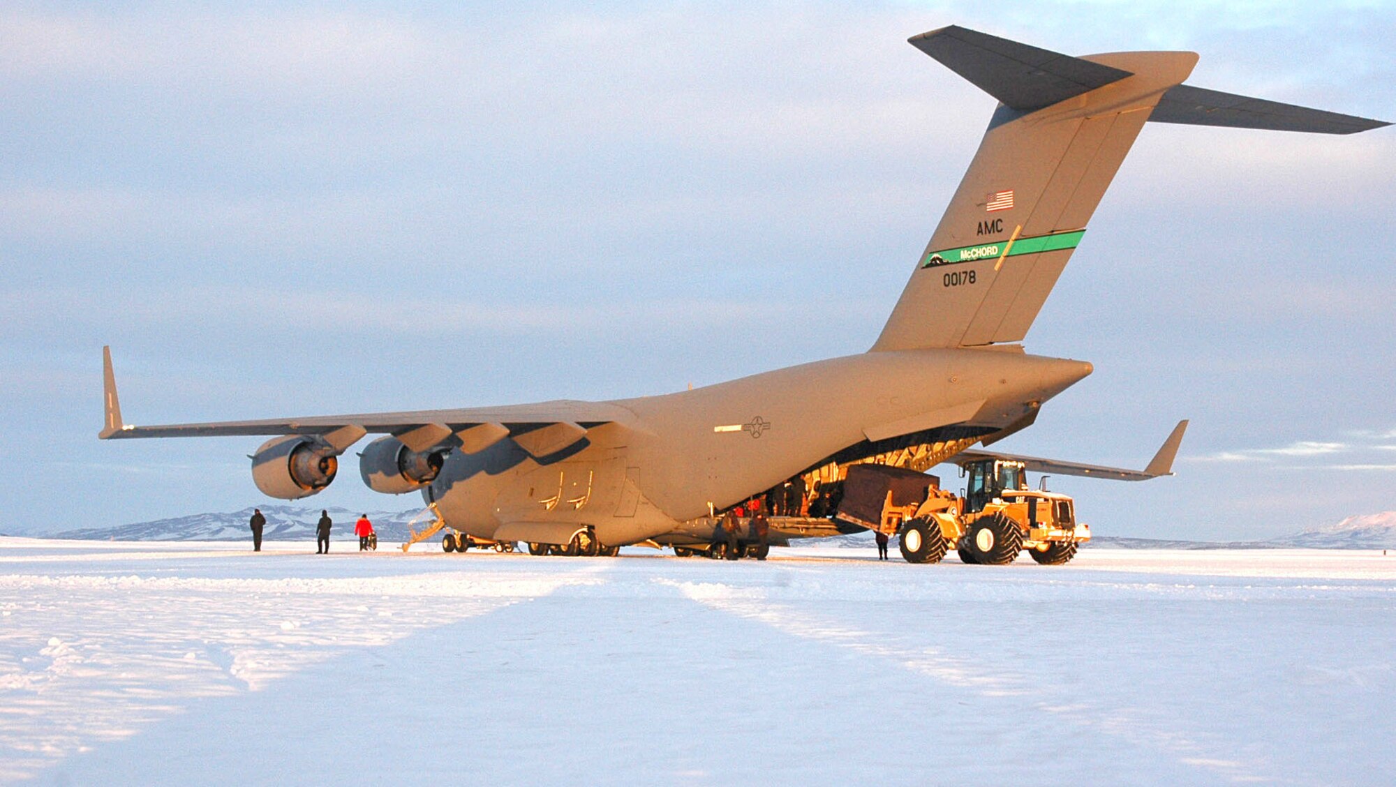 A C-17 Globemaster III from McChord Air Force Base, Wash., is loaded with cargo at McMurdo Station, Antarctica. A Reserve and active-duty Airmen from the 446th and 62nd Airlift  Wings flew the late season Operation Deep Freeze mission April 17. (U.S. Air Force photo/Tech. Sgt. Nick Przybyciel)