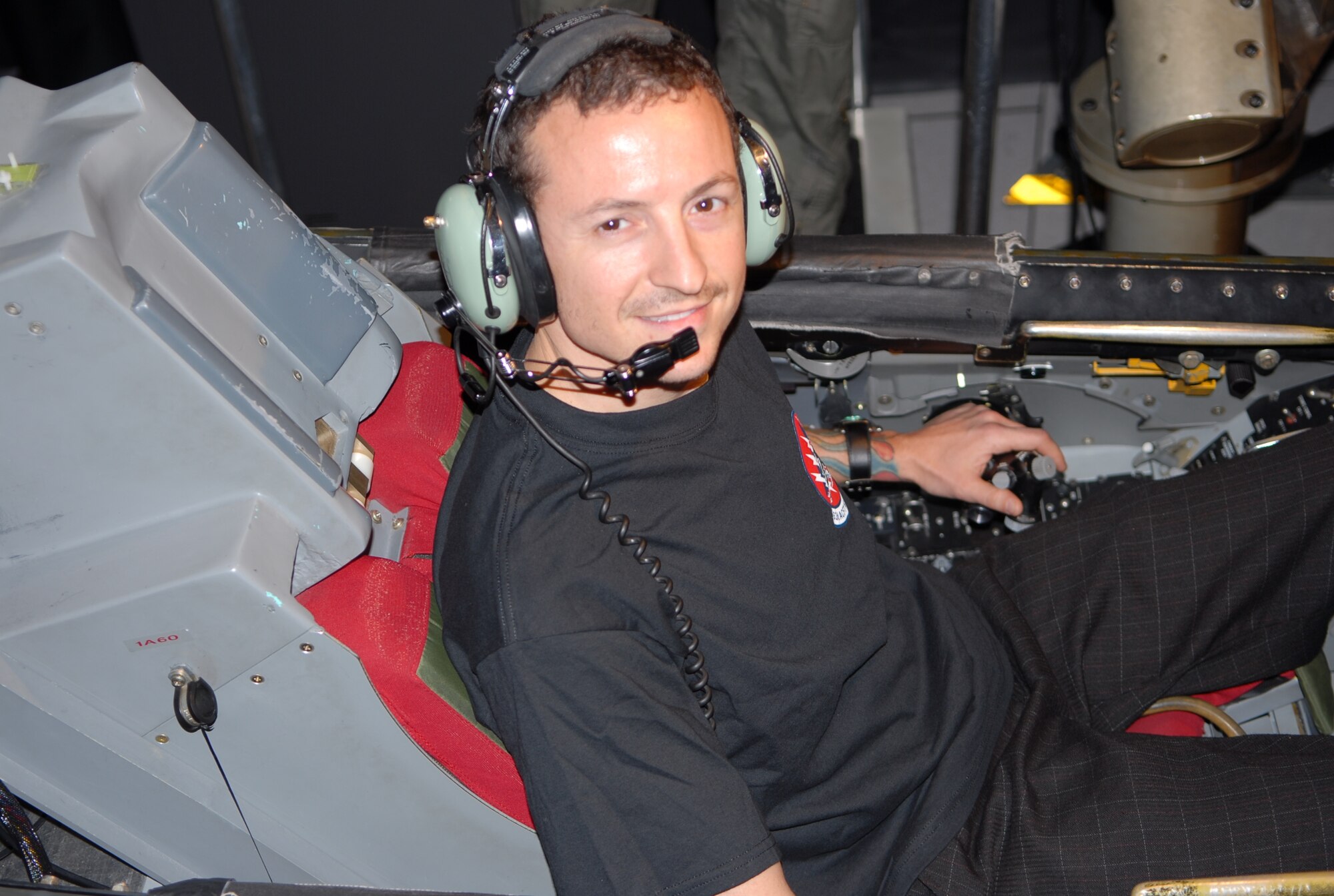 Chester Bennington anxiously awaits his first F-16 simulator experience during a visit to Luke April 1. 