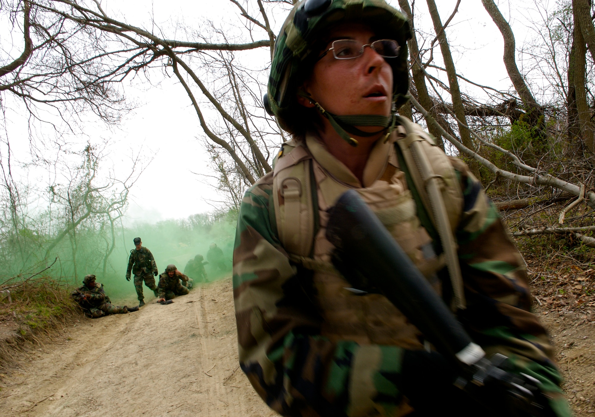 Capt. Sandra McDonald, a student  in Advanced Contingency Skills Training Course 08-4, provides security while fellow classmates attempt to carry  simulated wounded patients to a safe area during the combat first aid portion of the ACST course on a Fort Dix, N.J., range April 11, 2008.  The course is taught by the U.S. Air Force Expeditionary Center's 421st Combat Training Squadron and prepares Airmen for upcoming deployments. (U.S. Air Force Photo/Staff Sgt Samuel Rogers)