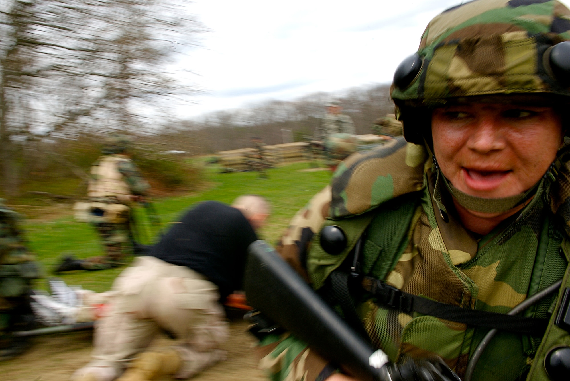 Firt Lt. Randi Norton, a student in Advanced Contingency Skills Training Course 08-4, provides security while fellow classmates attempt to carry  simulated wounded patients to a safe area during the combat first aid portion of the ACST course on a Fort Dix, N.J., range April 11, 2008. The course is taught by the U.S. Air Force Expeditionary Center's 421st Combat Training Squadron and prepares Airmen for upcoming deployments. (U.S. Air Force Photo/Staff Sgt. Samuel Rogers)