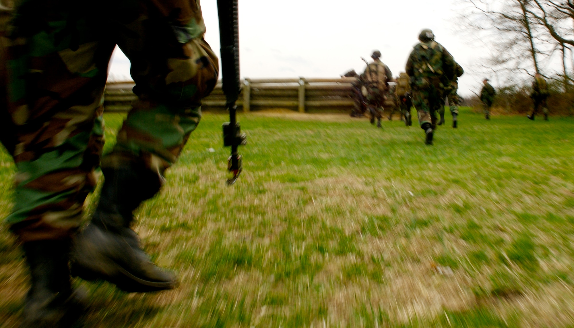 Students in the Advanced Contingency Skills Training Course 08-4 attempt to find cover and concealment while taking fire from opposing forces during the combat first aid portion of the ACST course on a Fort Dix, N.J., range April 11, 2008.  The course is taught by the U.S. Air Force Expeditionary Center's 421st Combat Training Squadron and prepares Airmen for upcoming deployments. (U.S. Air Force Photo/Staff Sgt. Samuel Rogers)