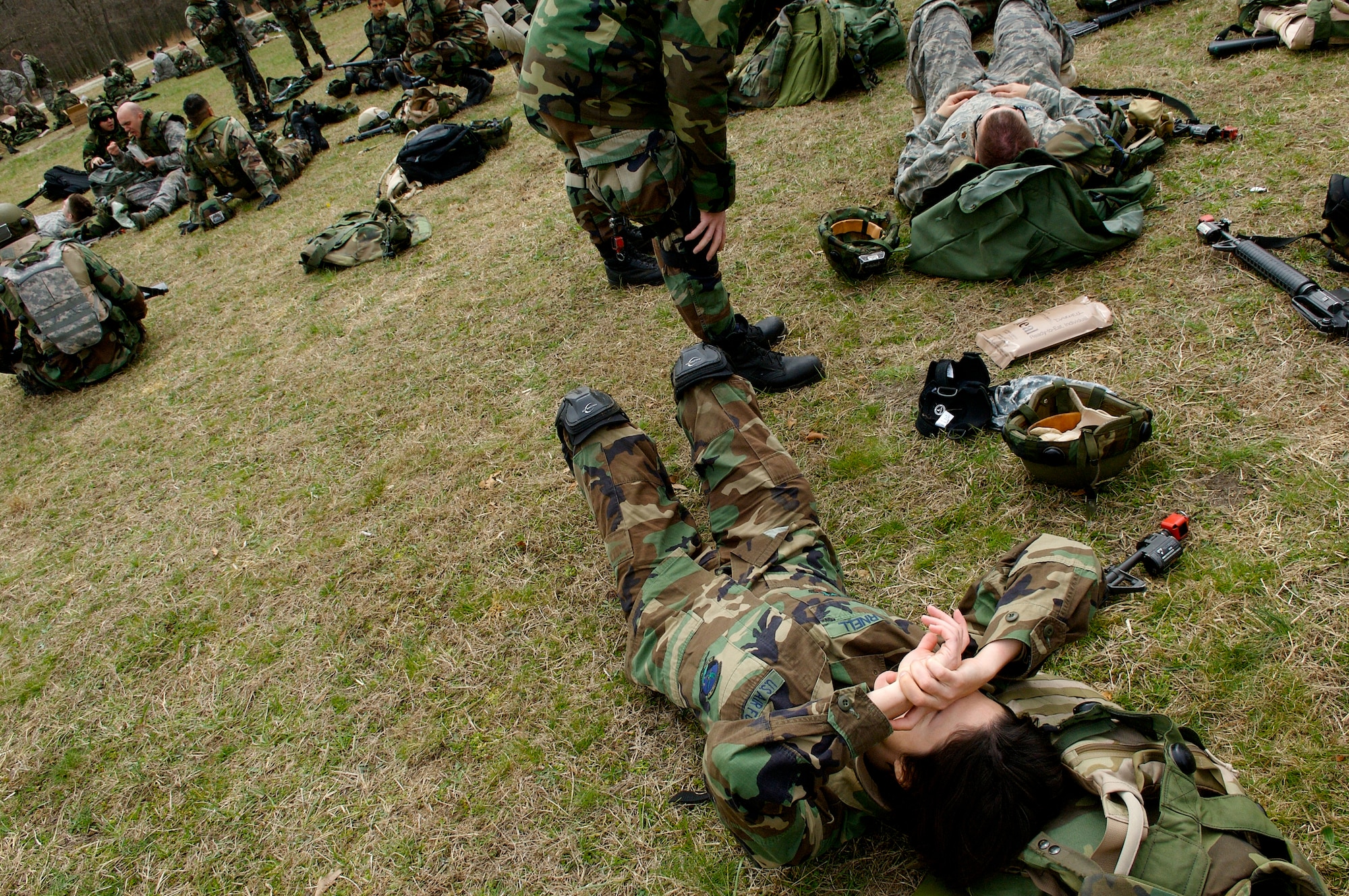 First Lt. Cynthia Darnell, as well as fellow students  in Advanced Contingency Skills Training Course 08-4, take a break after a grueling morning of tactical training on a rance on Fort Dix, N.J., April 8, 2008. The course is taught by the U.S. Air Force Expeditionary Center's 421st Combat Training Squadron and prepares Airmen for upcoming deployments. (U.S. Air Force Photo/Staff Sgt. Samuel Rogers)