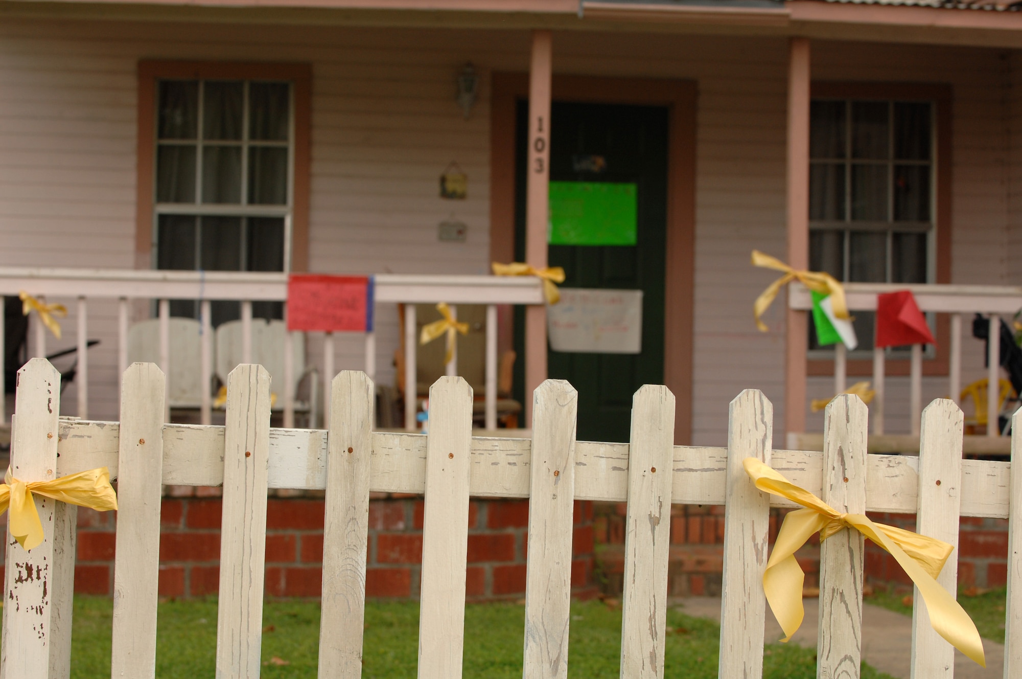 Yellow ribbons adorn the fence outside the home of Tech. Sgt. Michael McComb of 307th RED HORSE Squadron who recently returned to his hometown of Hawkins, Texas from a deployment to Iraq on April 13th. A parade and award presentation was held for Sergeant McComb and Staff Sgt. Cynthia Karch who are both members of RHS and residents of Hawkins. (U.S. Air Force photo by Airman 1st Class Joanna M. Kresge)