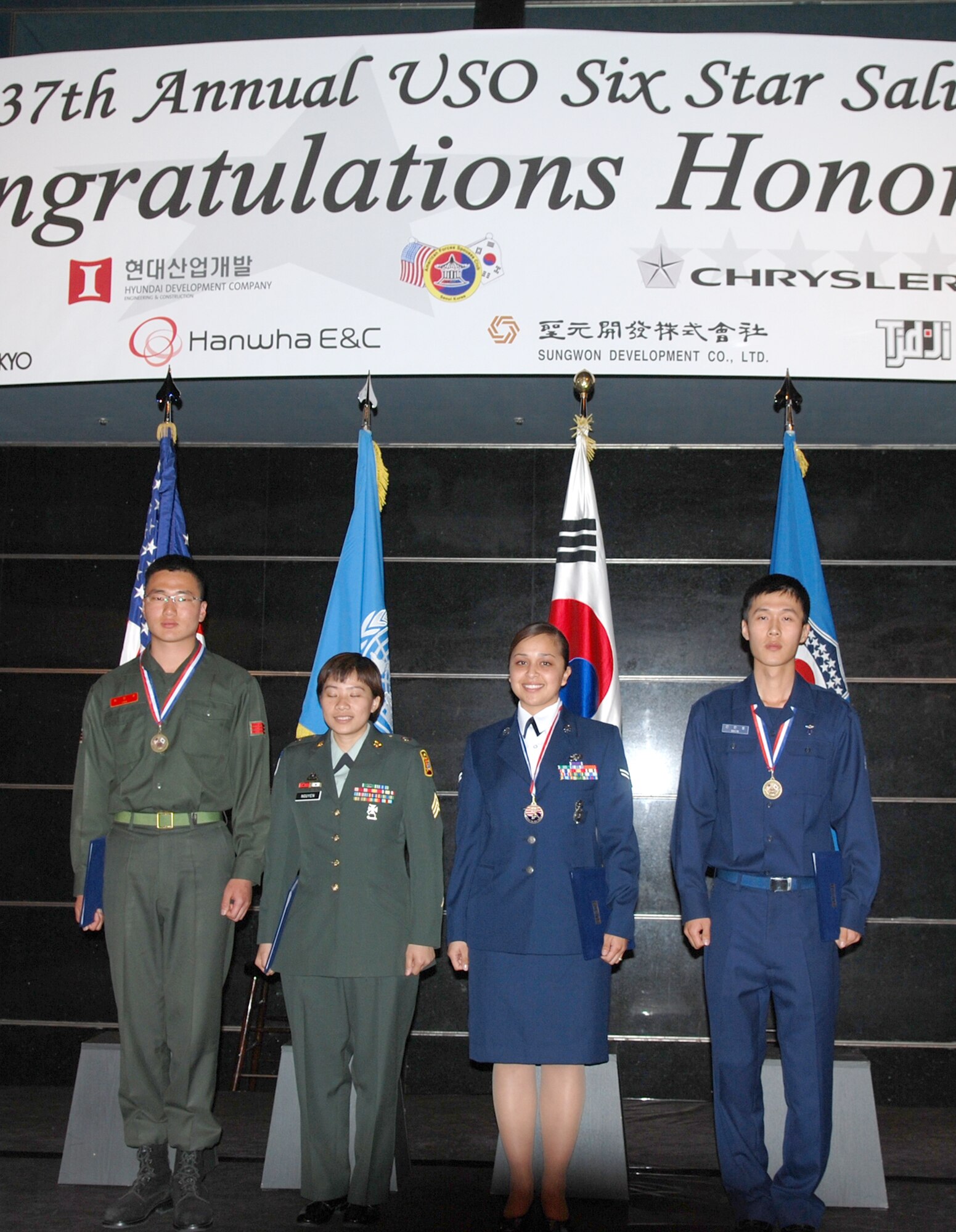 Airman 1st Class Jannette Meireles received a $2,500 scholarship while attending the United Service Organizations Six-Star-Salute banquet April 17 in Seoul, South Korea. Airman Meireles is an 8th Security Forces Squadron town patrol member at Kunsan Air Base, South Korea. (U.S. Air Force photo/Lt. Col. Rene White) 
