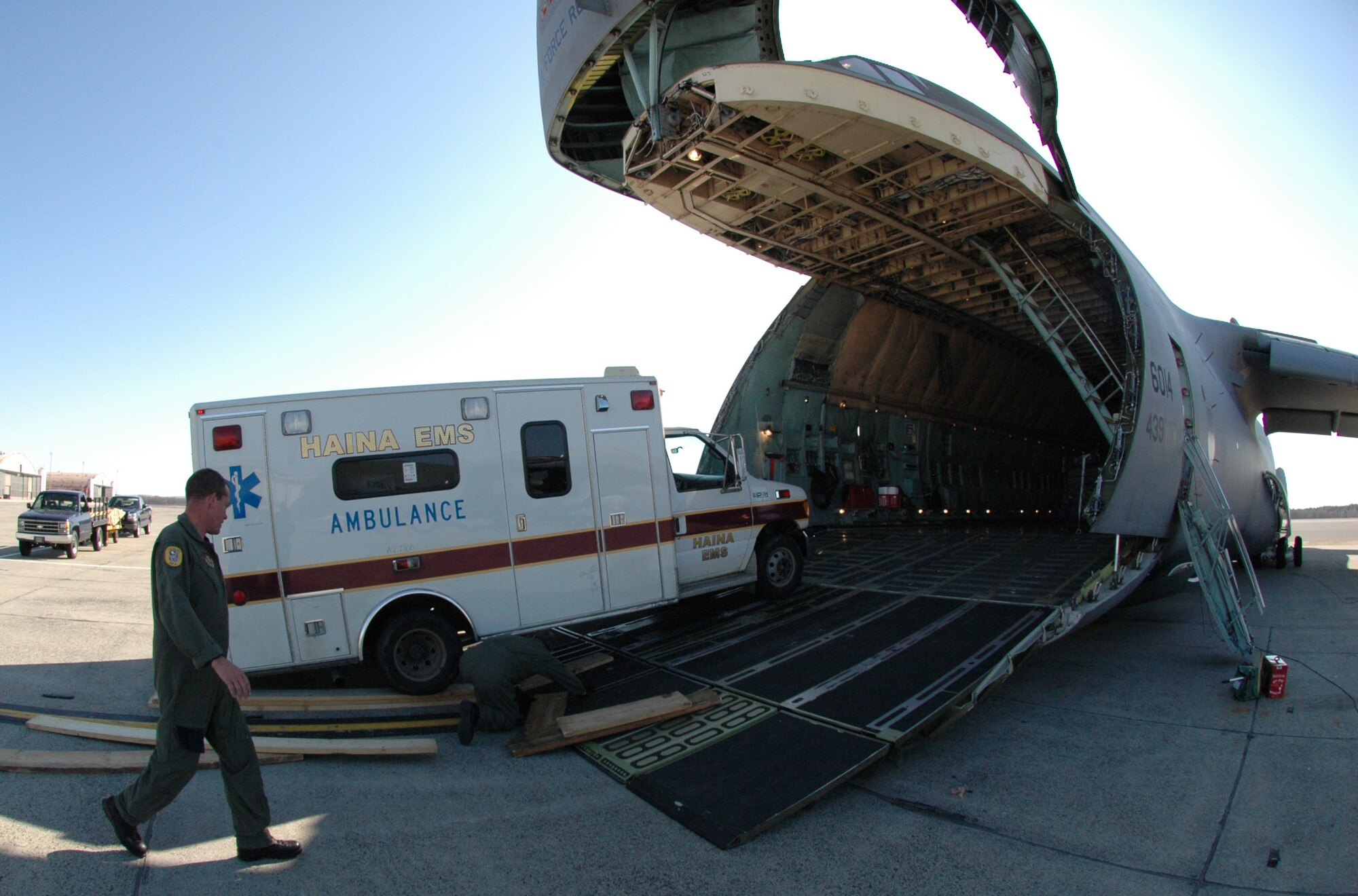 Airmen at Westover Air Reserve Base, Mass., load an ambulance bound for the Dominican Republic April 16. 