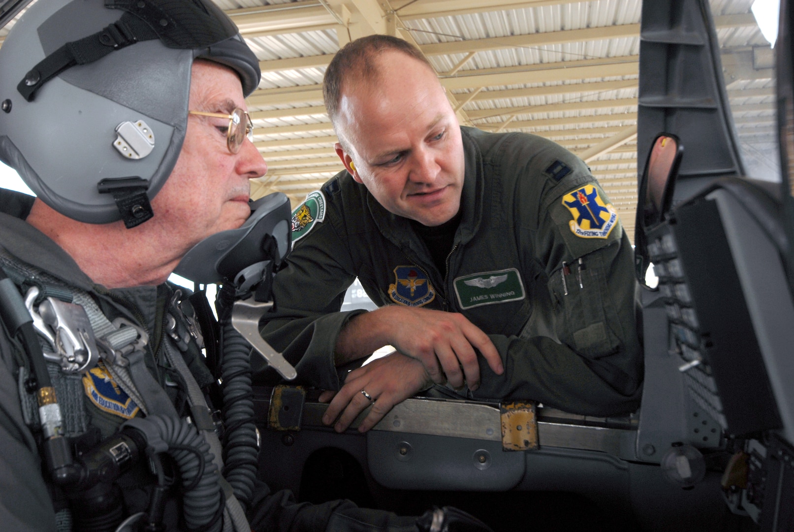 Capt. James Winning, 560th Flying Training Squadron, reviews cockpit controls with Col. (retired) Ken Cordier in a T-38 Talon March 28 during the 35th annual Freedom Flyers Reunion. Colonel Cordier was honored with a ride in the Talon. (U.S. Air Force photo by Steve White)