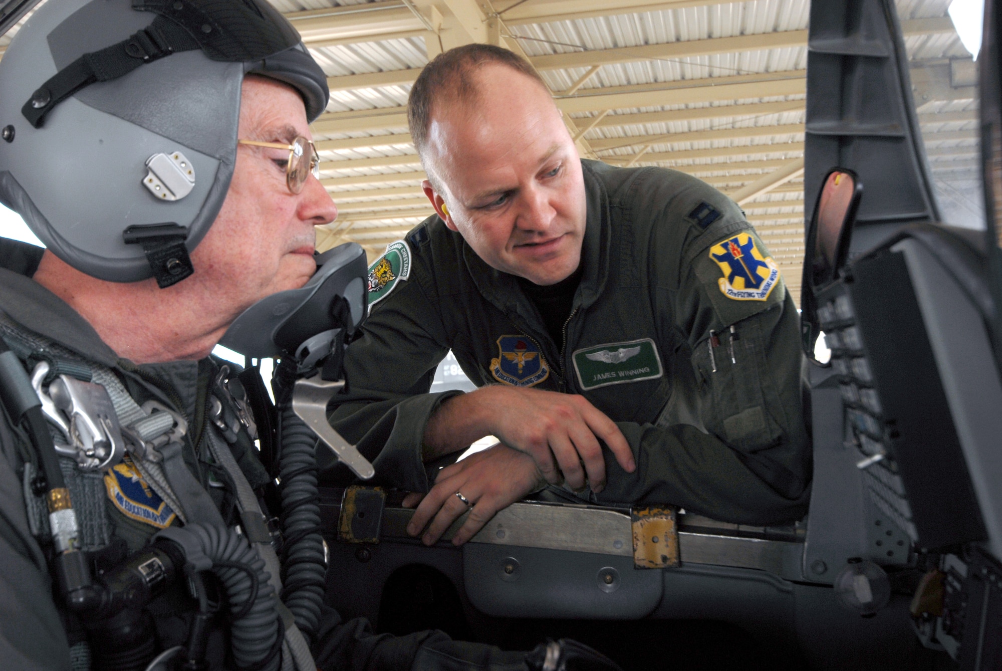 Capt. James Winning, 560th Flying Training Squadron, reviews cockpit controls with Col. (retired) Ken Cordier in a T-38 Talon March 28 during the 35th annual Freedom Flyers Reunion. Colonel Cordier was honored with a ride in the Talon. (U.S. Air Force photo by Steve White)