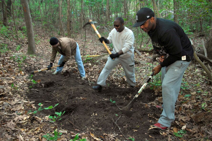 SHAW AIR FORCE BASE, S.C.--  Army Staff Sergeants Joshua Shirley and Bart Stevens along with Sgt. 1st Class Terry Heyward, 4th Battlefield Coordination Detatchment, repair a worn area on the Palmetto Point trail April 14. The 4th BCD, a 40-man unit here, is committed to a community outreach program with several projects geared towards their boots-on-the-ground mentality. (U.S. Air Force photo/Senior Airman William Coleman)