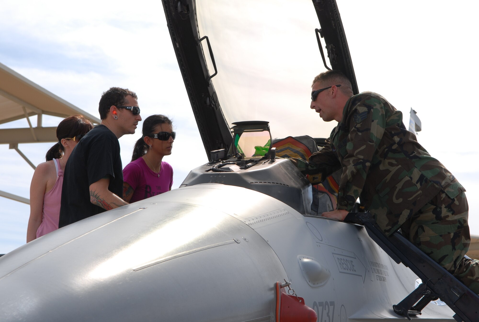 Chester Bennington, Linkin Park lead singer, and his wife, Talinda, get an indepth look at the cockpit of an F-16 during a visit to Luke AFB April 1.