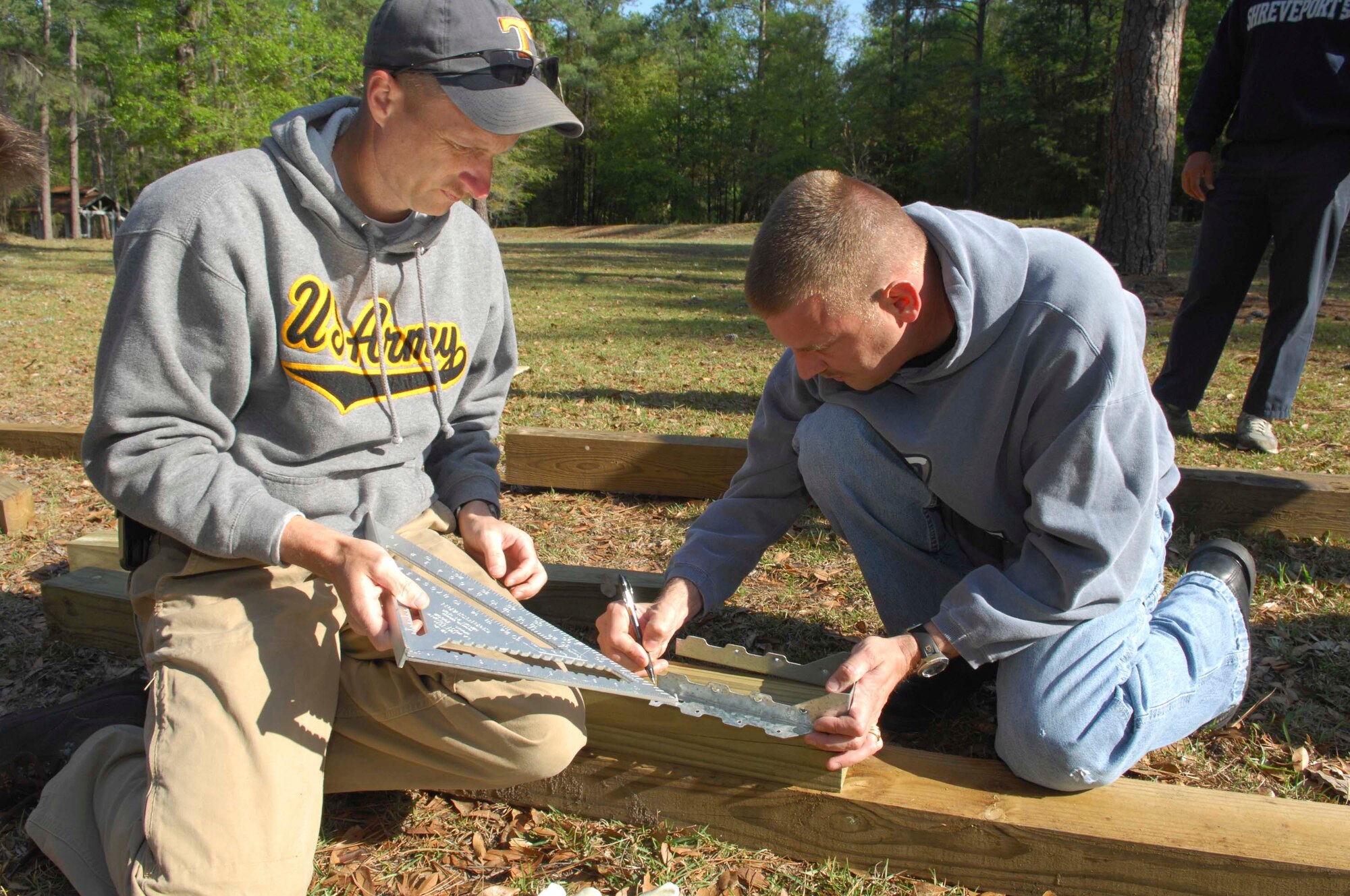 SHAW AIR FORCE BASE, S.C.--  Army Sgt. 1st Class Ronald Herd and Sgt. Maj. Paul Wyland, 4th Battlefield Coordination Detachment, construct an information kiosk at the Palmetto Point trail April14. The 4th BCD, a 40-man unit here, is committed to a community outreach program with several projects geared towards their boots-on-the-ground mentality. (U.S. Air Force photo/Senior Airman William Coleman)