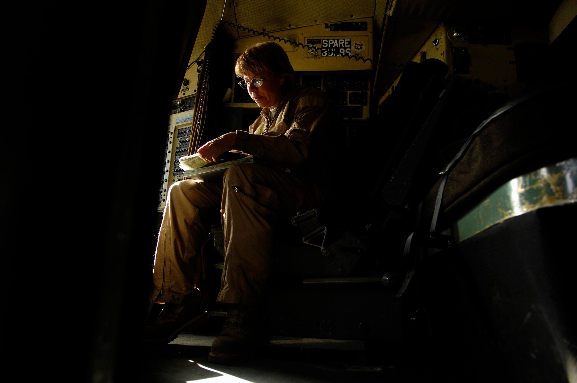 Tech. Sgt. Janna Cronk updates the mission data from a C-130 Hercules cargo mission April 16 from Bagram Air Base, Afghanistan. Sergeant Cronk is a flight engineer assigned to the 774th Expeditionary Airlift Squadron and deployed from the 105th Airlift Squadron from Nashville, Tenn. (U.S. Air Force photo/Master Sgt. Andy Dunaway)