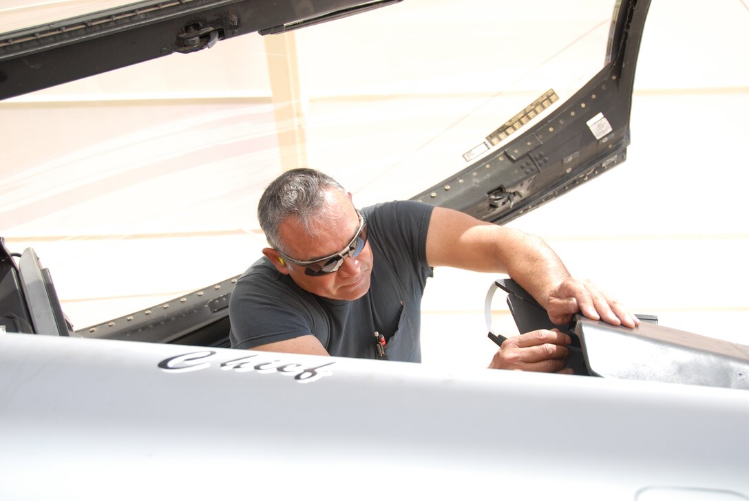 Techncal Sergeant (TSgt) Geronimo Guerrero, a crew chief with the 149th Fighter Wing, Texas Air National Guard, San Antonio, Texas, checks the lox gauges on an F-16 as he preps the jet for a mission on April 14th, 2008. The 149FW is deployed to Davis-Monthan Air Force Base in Tucson, Arizona, participating in Coronet Cactus, an annual training mission. (Air National Guard photo by SSgt Andre Bullard) (RELEASED)