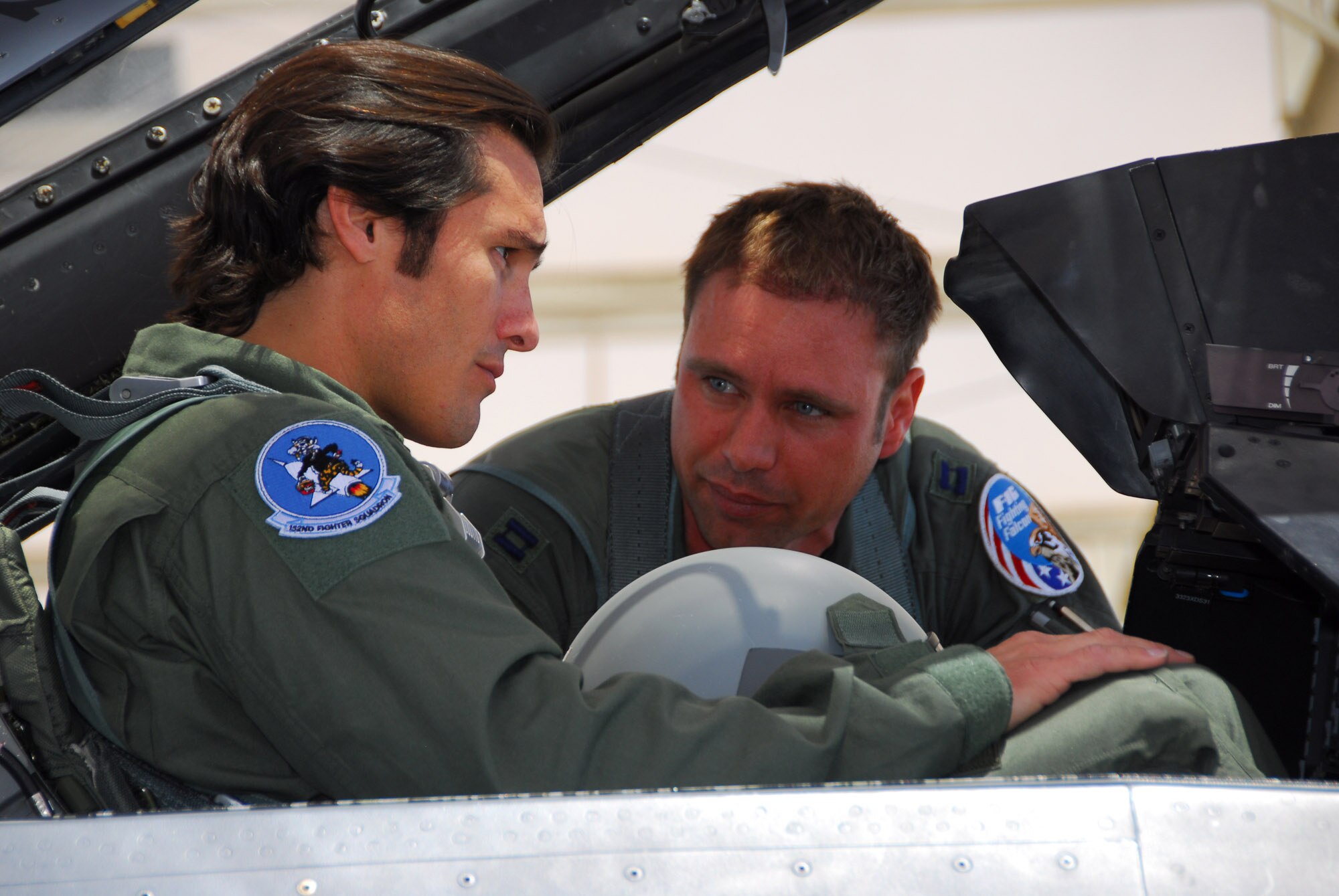 F-16 pilot, Capt. Jason Lewis (right) checks on Joe Nichols before his orientation flight with the 162nd Fighter Wing.