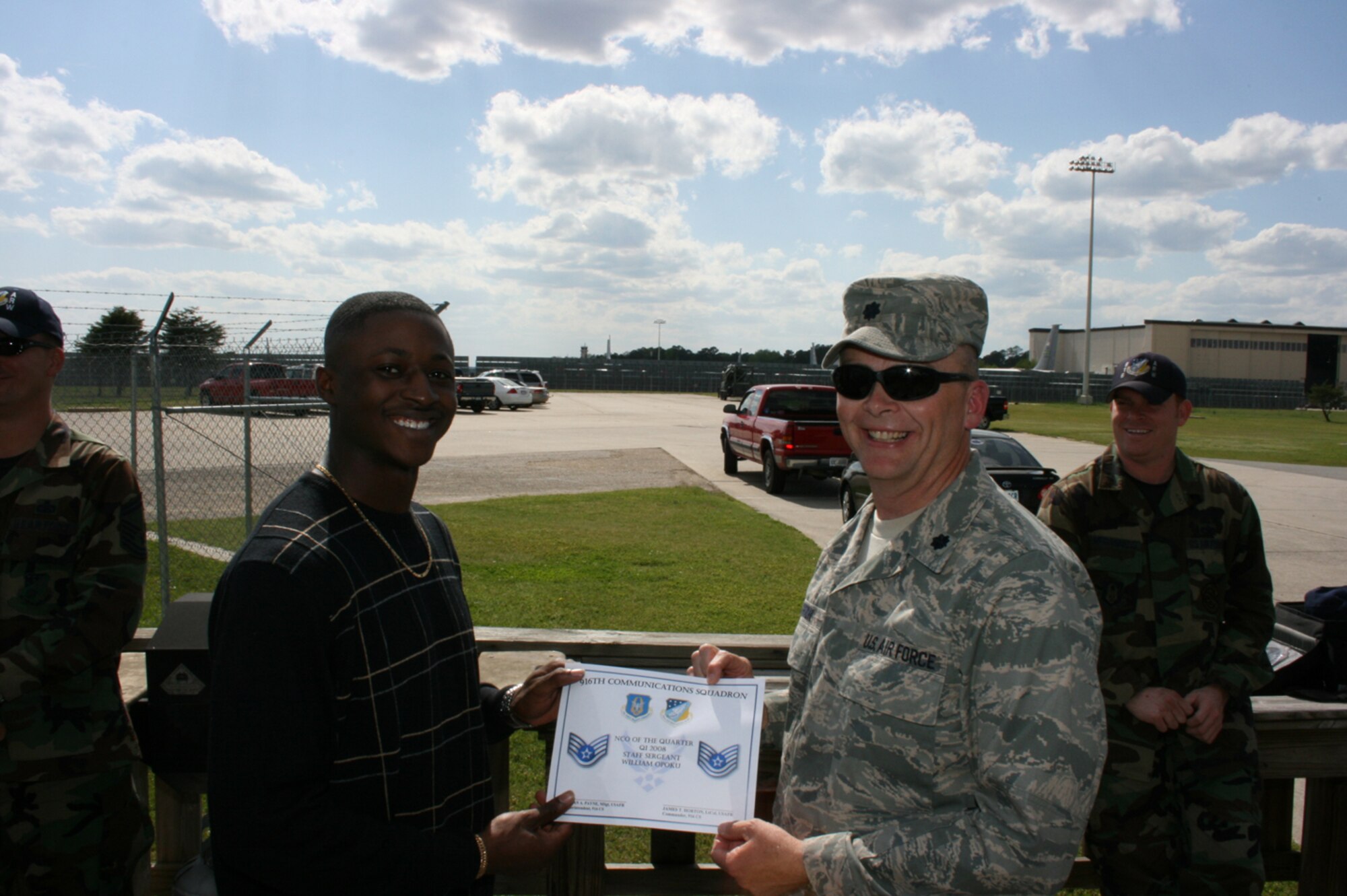 SEYMOUR JOHNSON AIR FORCE BASE, N.C. -- Staff Sgt. William Opoku (left) receives the 916th Communication Squadron Non-commissioned Officer of the Quarter recognition award from his commander, Lt. Col. James Horton. Sergeant Opoku is an information management apprentice.
