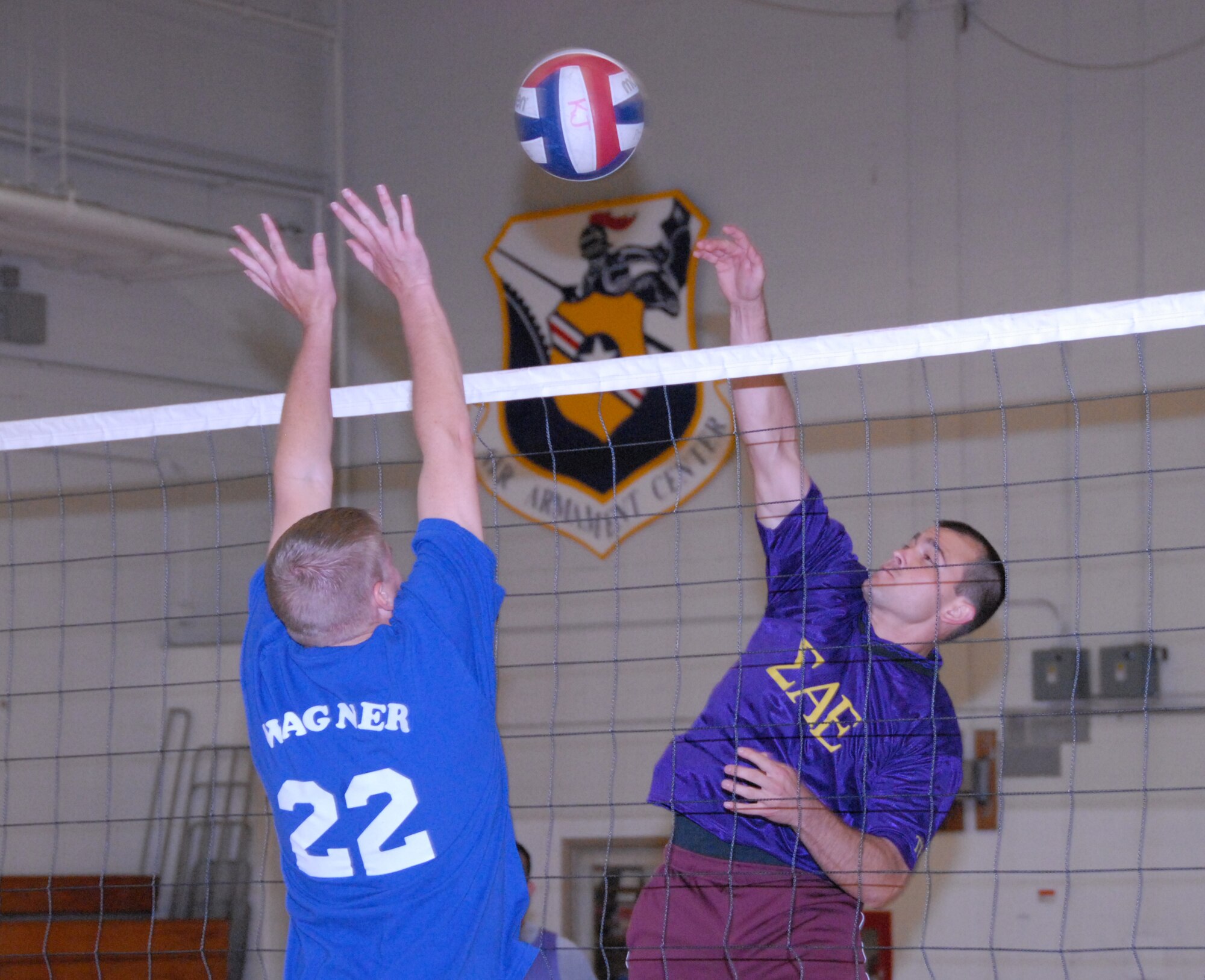 Rob Stripling, 53d Wing, spikes the ball past a 96th Communications Squadron defender April 17 during an intramural playoff game at Eglin Air Force Base, Fla. The 53d lost a close match to go 9-5 on the year. The COMM team moved on to play the 33rd Maintenance Squadron in the finals. Photo by Staff Sgt. Samuel King Jr. 
