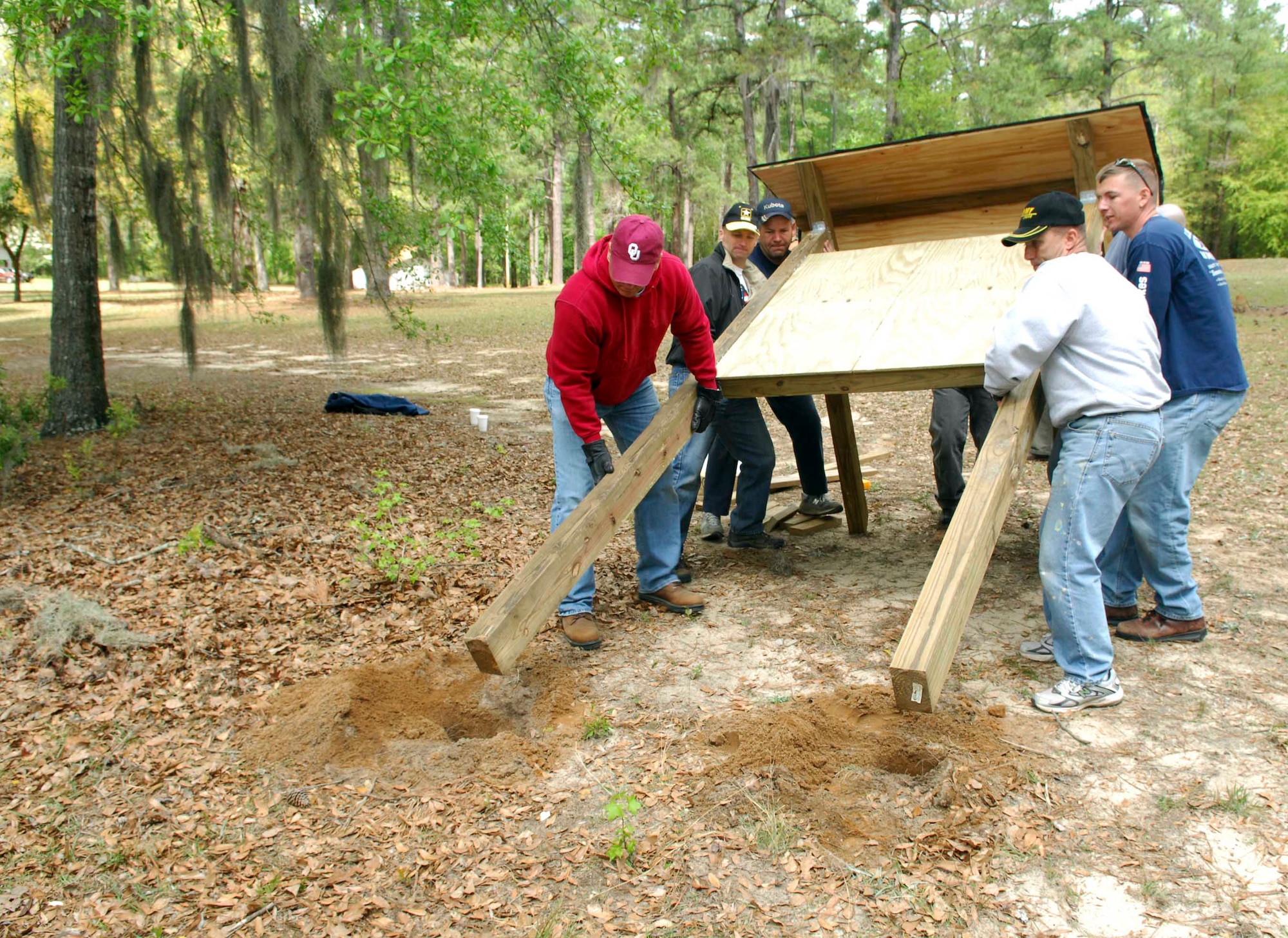 SHAW AIR FORCE BASE, S.C.-- Soldiers from the 4th Battlefield Coordination Detachment install an information kiosk at the state park trail head April 14.  The 4th BCD, a 40-man unit here, is committed to a community outreach program with several projects geared towards their boots-on-the-ground mentality. (U.S. Air Force photo/Senior Airman William Coleman)