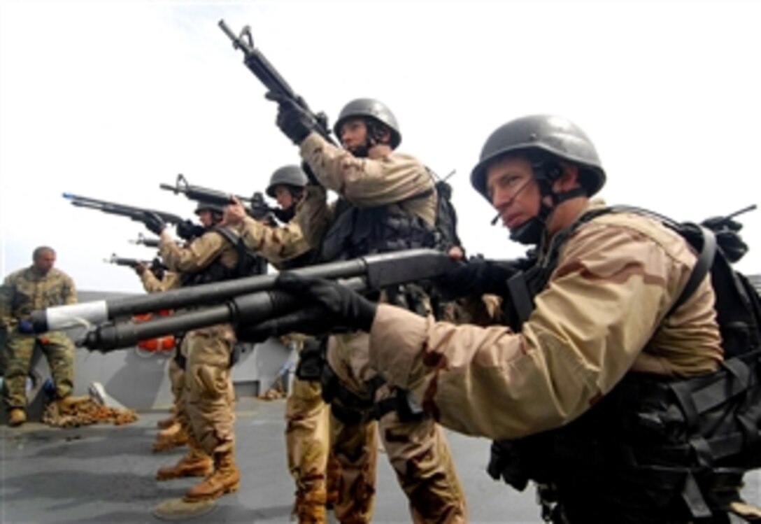 U.S. Navy sailors from the guided-missile frigate USS John L. Hall take control of a landing craft after boarding it by rigid hull inflatable boat in the Mediterranean during Exercise Phoenix Express 2008, April 17, 2008. Phoenix Express is an annual multinational exercise designed to improve regional cooperation and maritime security in the Mediterranean basin.