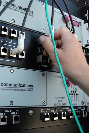 Pfc. Paul C. Wilbanks, a scout with Task Force Mustang, 2nd Light Armored Reconnaissance Battalion, Regimental Combat Team 5, helps lift a box towards his living area during an annual re-supply at Combat Outpost 160K, Iraq, April 18. Marines with TF Mustang stationed at Combat Outpost 70K support all posts in and around western Anbar province, Iraq.