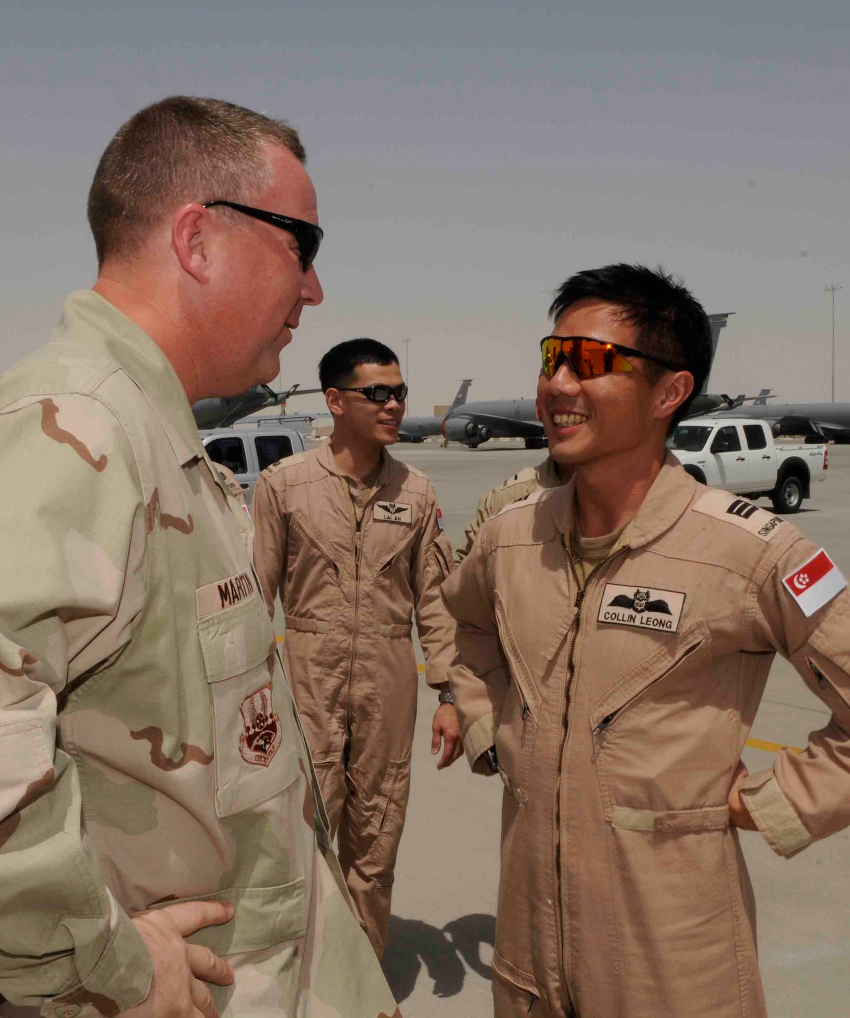 Col. Larry Martin, 379th AEW vice commander, welcomes RSAF KC-135 pilot Capt. Colin Leong to Southwest Asia April 16. (U.S. Air Force photo/Tech. Sgt. Johnny Saldivar)
