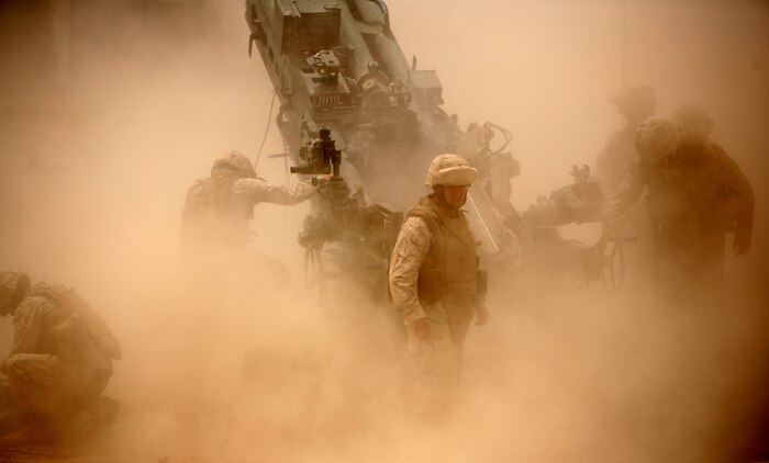 Marines from Battery M, 3rd Battalion, 11th Marine Regiment fire an M777 howitzer during a training exercise aboard Camp Fallujah, Iraq, April 19. Marines from the battery are supporting a myriad of roles during their deployment with Regimental Combat Team 1 including personal security detachments and explosive ordnance disposal security teams. (Official U.S. Marine Corps photo by Sgt Nathaniel C. LeBlanc)