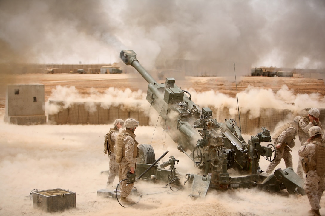 Marines from Battery M, 3rd Battalion, 11th Marine Regiment fire an M777 howitzer during a training exercise aboard Camp Fallujah, Iraq, April 19. Marines from the battery are supporting a myriad of roles during their deployment with Regimental Combat Team 1 including personal security detachments and explosive ordnance disposal security teams. (Official U.S. Marine Corps photo by Sgt Nathaniel C. LeBlanc)