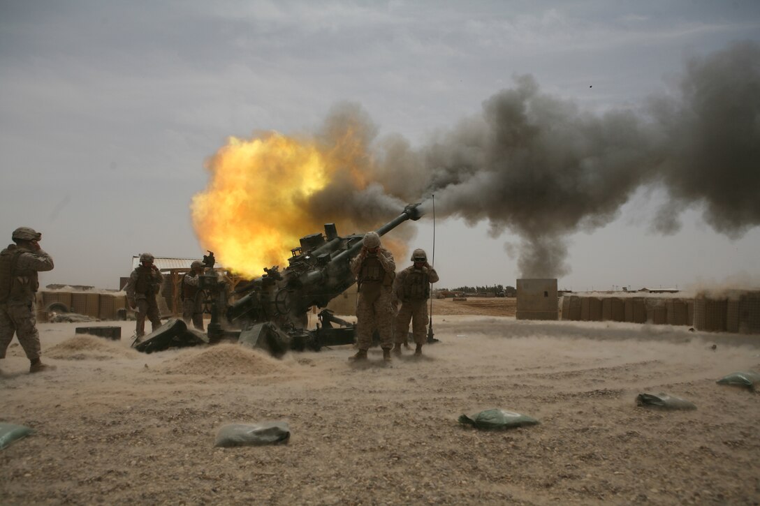 Marines from Battery M, 3rd Battalion, 11th Marine Regiment fire an M777 howitzer during a training exercise aboard Camp Fallujah, Iraq, April 19. Marines from the battery are supporting a myriad of roles during their deployment with Regimental Combat Team 1 including personal security detachments and explosive ordnance disposal security teams. (Official U.S. Marine Corps photo by 1st Lt. Ted Vickers)