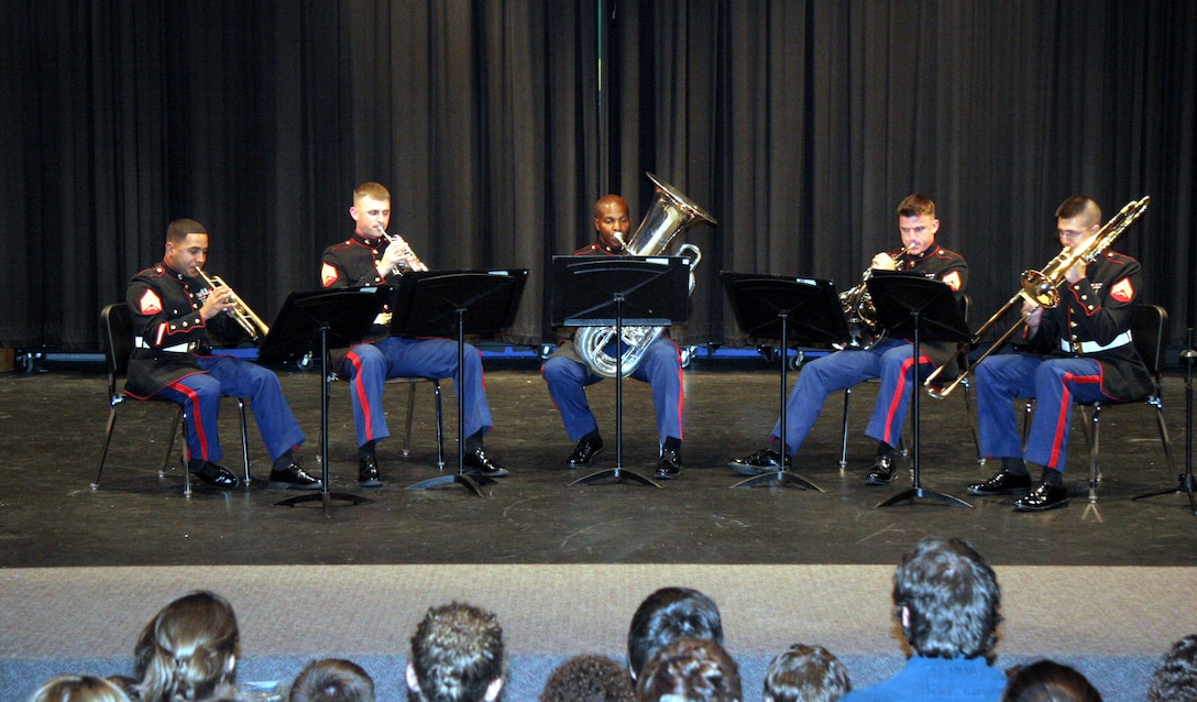 Members of the brass quintet from the Marine Corps Air Ground Combat Center Twentynine Palms, Calif., perform at Thornapple-Kellogg High School, Kalamazoo, Mich., April 22. The quintet went on a five-day tour of Recruiting Station Lansing April 21-25, performing for the public and offering clinics for students.