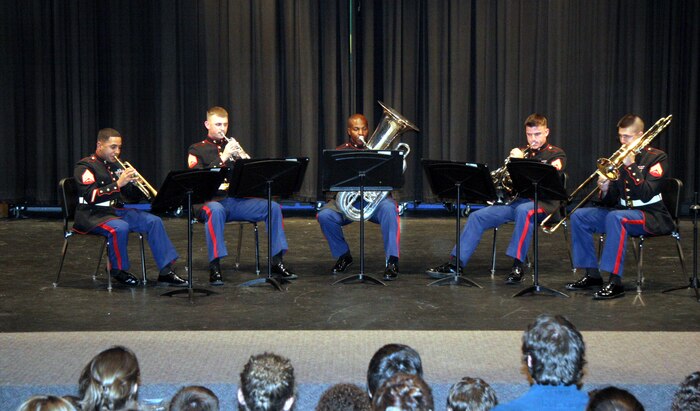 Members of the brass quintet from the Marine Corps Air Ground Combat Center Twentynine Palms, Calif., perform at Thornapple-Kellogg High School, Kalamazoo, Mich., April 22. The quintet went on a five-day tour of Recruiting Station Lansing April 21-25, performing for the public and offering clinics for students.