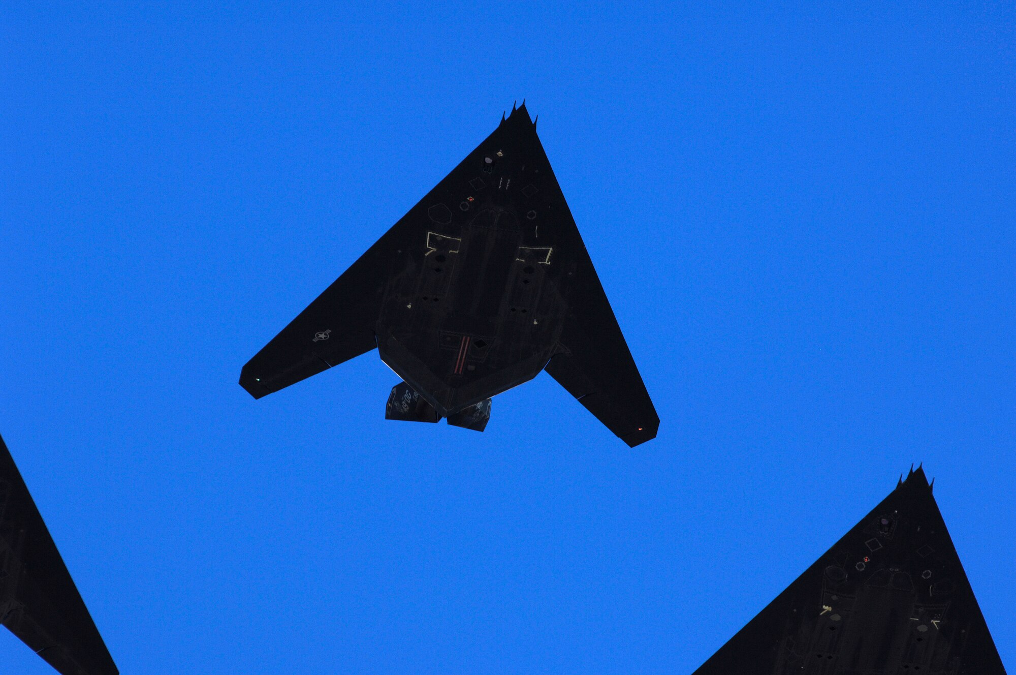 The final four F-117A Nighthawk's fly over Holloman AFB, N.M. during the Sunset Stealth retirement ceremony, 21 April 2008. The F-117A flew under the flag of the 49th Fighter Wing at Holloman Air Force Base, New Mexico from 1992 to its retirement in 2008. (U.S. Air Force Photo by SSgt Jason Colbert)