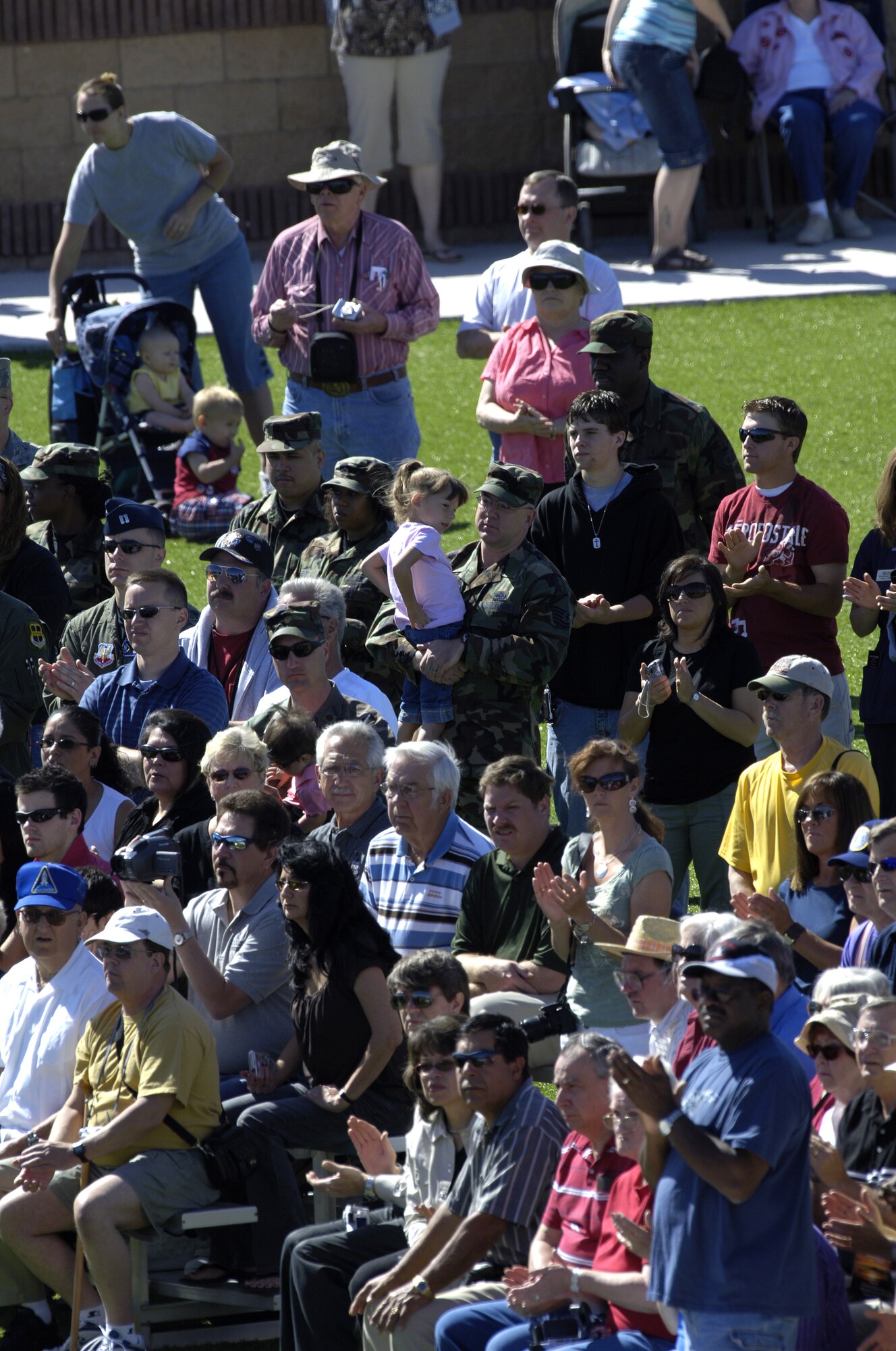 Members of the Holloman community gather to observe the Sunset Stealth retirement ceremony at Holloman AFB, N.M., 21 April 2008. The F-117A flew under the flag of the 49th Fighter Wing at Holloman Air Force Base, New Mexico from 1992 to its retirement in 2008. (U.S. Air Force Photo by SSgt Jason Colbert)