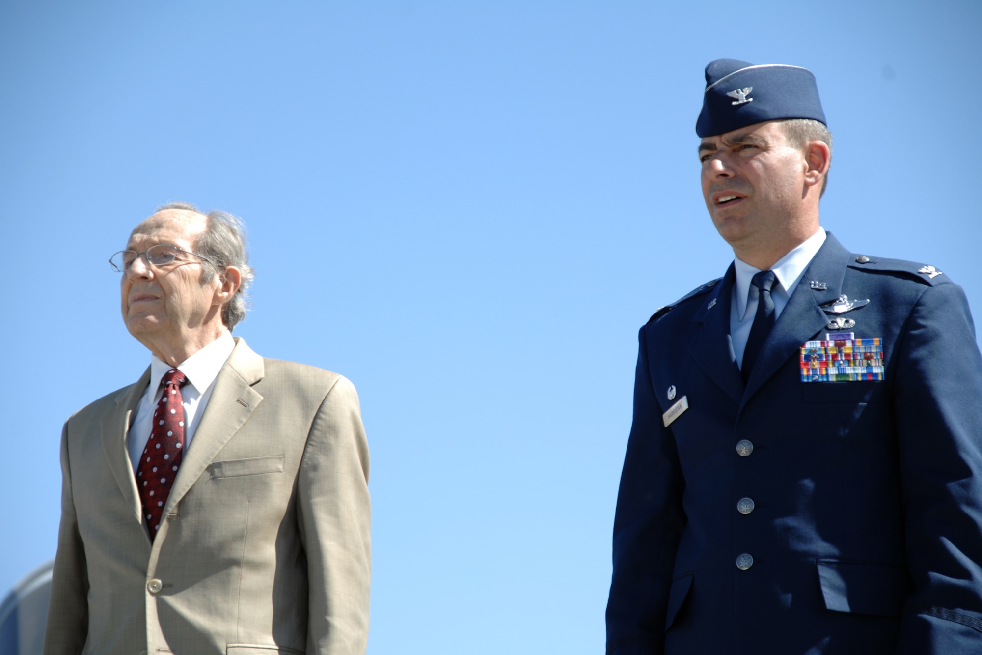 HOLLOMAN AIR FORCE BASE, N.M.--Dr. William Perry, former Secretary of Defense, and 49th Fighter Wing Commander Col. Jeff Harrigian stand during the singing of the Air Force Song at the conclusion of the Sunset Stealth retirement ceremony April 21, 2008, here at Heritage Park. The ceremony retired the final four F-117A Nighthawks. During the ceremony, the four Nighthawks flew in formation on their way to Tonopah, Nev., which will serve as their final resting spot. (U.S. Air Force photo/Airman 1st Class Jamal D. Sutter)