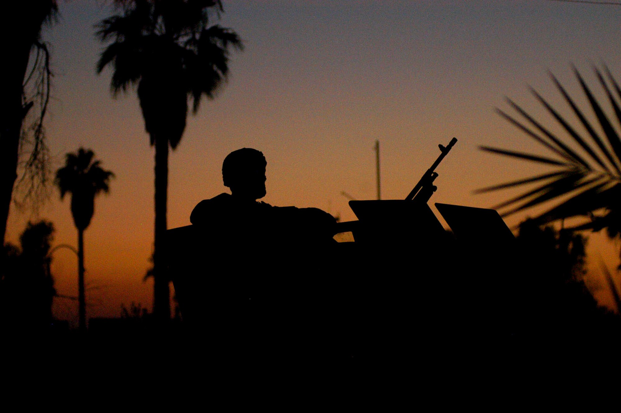 An Airman from the 506th Expeditionary Security Forces Squadron at Kirkuk Regional Air Base, Iraq, sits atop a Humvee turret during an evening patrol. While typical perceptions associated with the Air Force in combat might involve aircraft dropping bombs on targets, the several hundred security forces Airmen deployed here are proving these stereotypes outdated.  (U.S. Air Force photo/Master Sgt. Dale Canofari) 