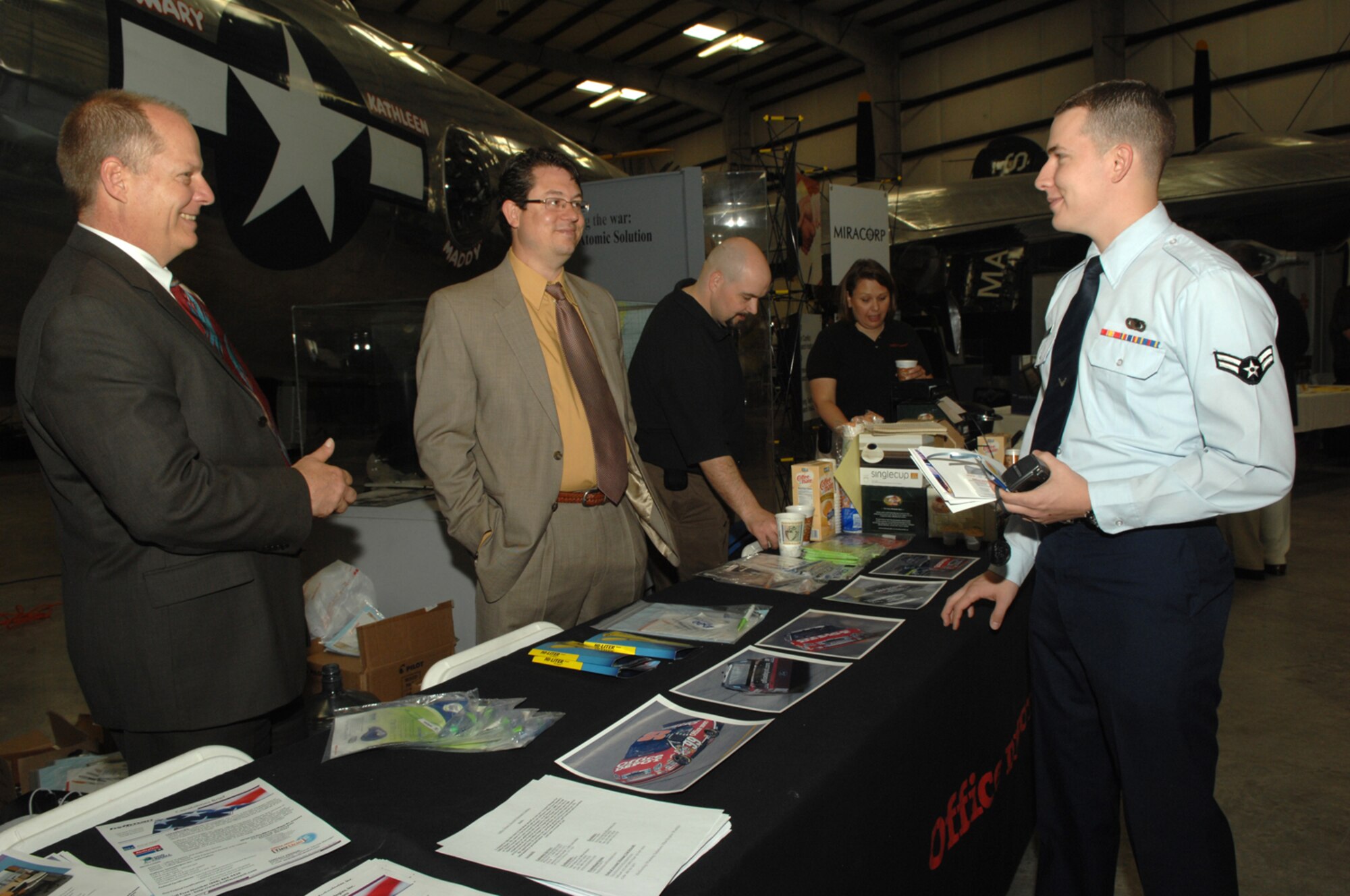 Airman 1st Class David Poppe, a member of the 355th Contracting Squadron, speaks to vendors at the 10th Annual Southern Arizona Procurement Fair held at the Pima Air and Space Museum April 18. More than 140 vendors and over 80 members of the D-M community attended the fair. The fair was sponsored by D-M, Pima County Procurement and Tucson Regional Economic Opportunities.  (U.S. Air Force photo by Senior Airman Alesia Goosic)