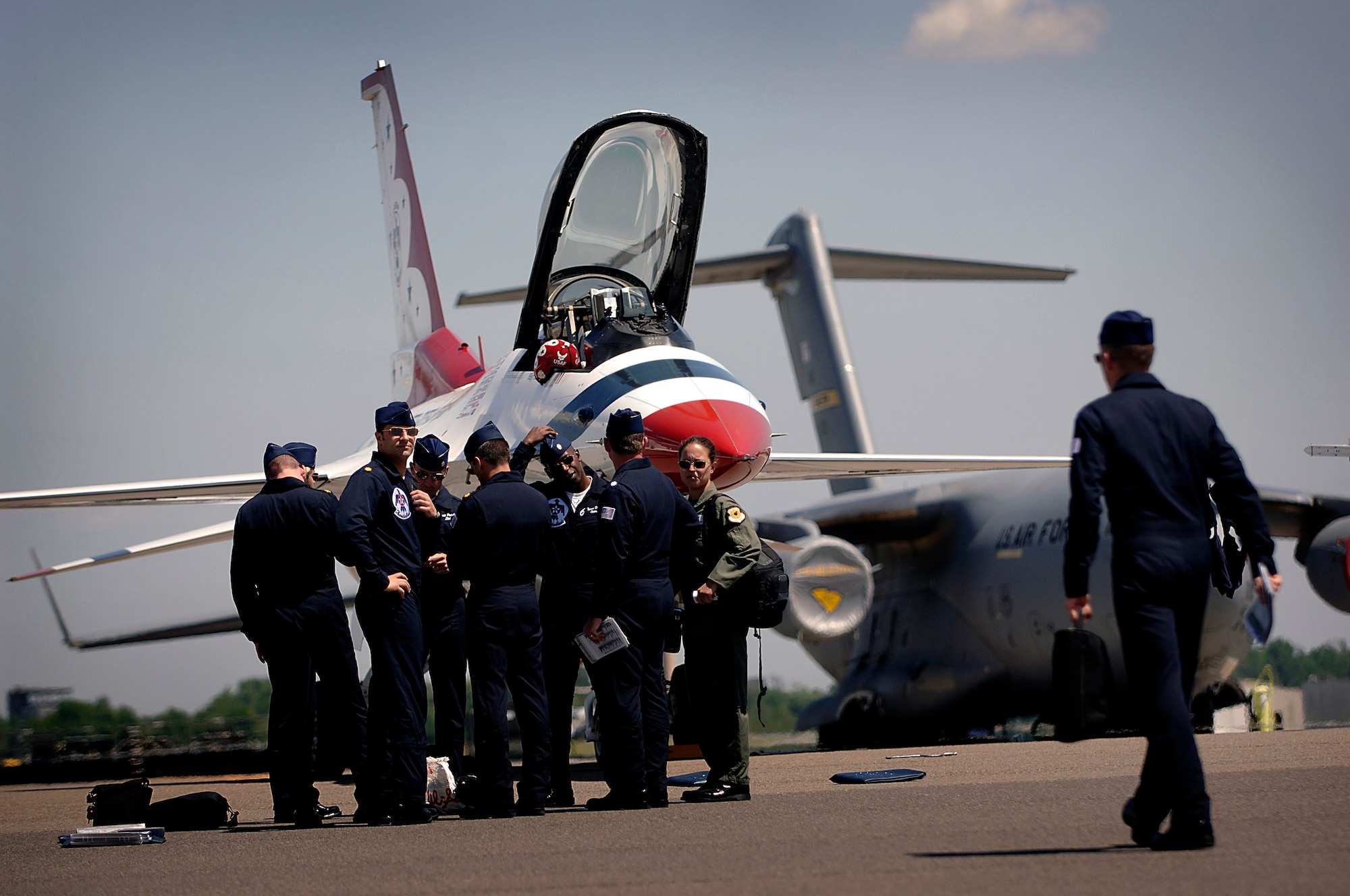 The Thunderbird pilots wait to be briefed by Lt. Col. Greg Thomas after they arrive on the Charleston AFB flightline Monday. Colonel Thomas is the commander of the air demonstration team and flies the Thunderbirds number one jet and will be performing at the 2008 "Wings Over Charleston" Air Expo at Charleston AFB Saturday. (U.S. Air Force Photo/Senior Airman Nicholas Pilch)