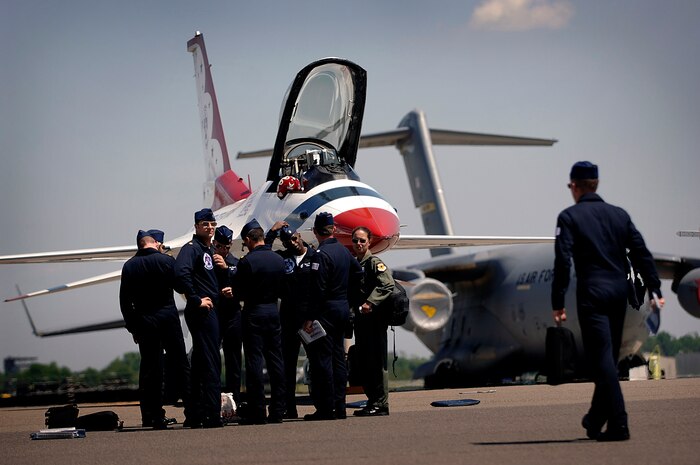 The Thunderbird pilots wait to be briefed by Lt. Col. Greg Thomas after they arrive on the Charleston AFB flightline Monday. Colonel Thomas is the commander of the air demonstration team and flies the Thunderbirds number one jet and will be performing at the 2008 "Wings Over Charleston" Air Expo at Charleston AFB Saturday. (U.S. Air Force Photo/Senior Airman Nicholas Pilch)