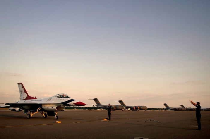 Tech. Sgt. David Batterson and Staff Sgt. Walter Jenkins marshal in Maj. Anthony Mulhare on the Charleston AFB flightline April Sunday. Major Mulhare is the pilot for U.S. Air Force Thunderbird Eight while Sergeants Batterson and Jenkins are crew chiefs with the Thunderbirds advance team. The Thunderbirds will be performing at the "Wings Over Charleston" 2008 Air Show Saturday.  (U.S. Air Force photo/Senior Airman Nicholas Pilch)