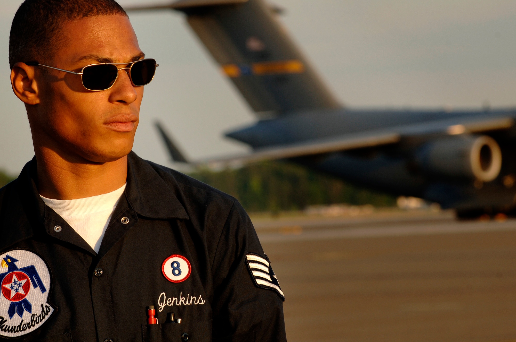 Staff Sgt. Walter Jenkins prepares to marshal in Thunderbird Eight on the Charleston AFB flightline Sunday. Sergeant Jenkins is a crew chief with the Thunderbirds advance team. The Thunderbirds will be performing at the "Wings Over Charleston" 2008 Air Show Saturday.  (U.S. Air Force photo/Senior Airman Nicholas Pilch)