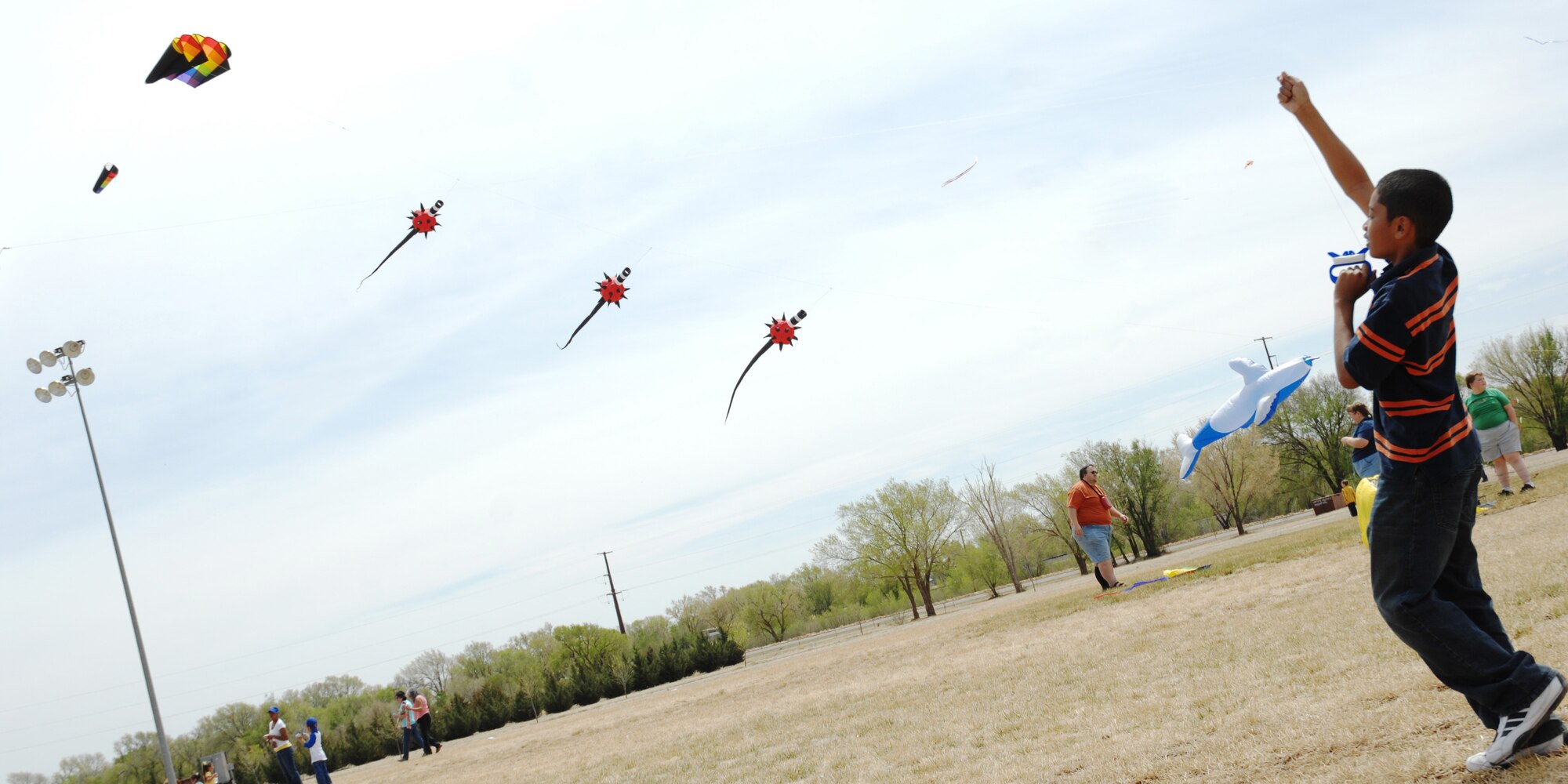CANNON AIR FORCE BASE N.M.-- Tyson Washington flies a kite during the annual Kite Karnival April 19 at Doc Stewart Park. The Kite Karnival is a Community Center "Let's Celebrate!" trademark event that attracts close to 2,500 people from the surrounding area to experience kite flying at its best.  (U.S. Air Force photo/Airman 1st Class Evelyn Chavez)  